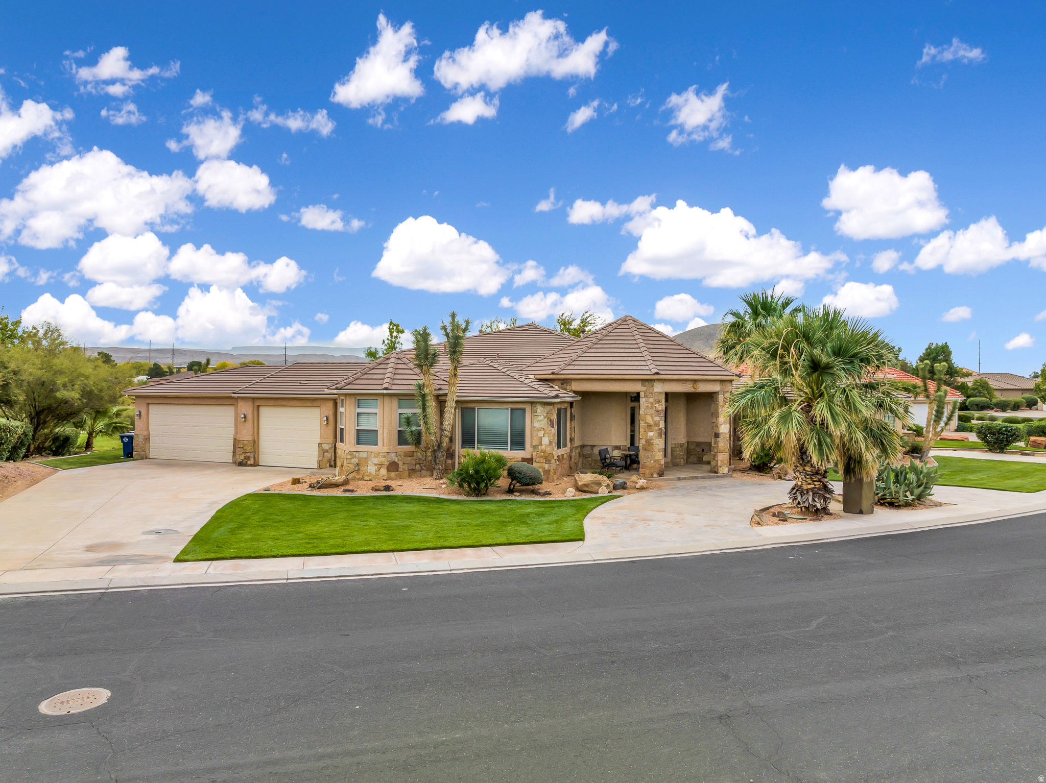 **BEST VALUE IN WASHINGTON COUNTY FOR LOCATION AND SIZE!!**This Hurricane home is a dream property! Its location is near all the popular attractions of Saint George... (boating, mountain biking, hiking, etc.) it backs up to the 11th hole of one of the prettiest golf courses in Southern Utah! You can relax on the large upper deck, and enjoy views of Pine Valley Mountain, and Zions. The custom architecture, three fireplaces, and Travertine floors add a touch of luxury to the home. The theater room is perfect for entertainment, and the interior lighting creates a cozy ambiance. The presence of two primary suites and a second kitchen with a separate entrance adds convenience and flexibility. The outdoor amenities, such as the built-in BBQ, fridge, fire pit, misters, and rope lighting, provide a great space for entertaining friends and family. It's worth mentioning that there is a possibility for a furniture package. Buyer to verify all information, including utilities and HOA details.