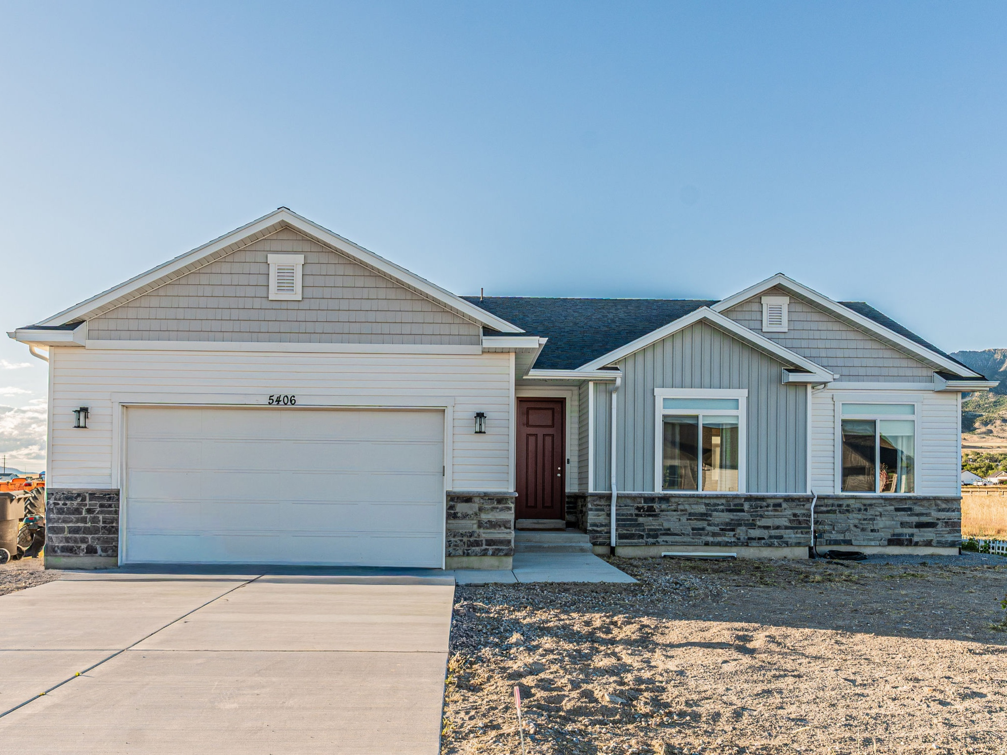 **OPEN HOUSE - SATURDAY, JULY 11 @ 11:00AM-12:00PM** Discover the peace and beauty of COUNTRY LIVING without sacrificing convenience. PERFECT FOR COMMUTERS, REMOTE WORKERS, OUTDOOR ENTHUSIASTS, OR ANYONE LOOKING TO ESCAPE THE HUSTLE while still being just 4 minutes from I-15-close enough for an easy commute, yet far enough away to enjoy QUIET NIGHTS, CLEAN AIR, and the kind of SERENITY that's becoming harder to find. Wake up to breathtaking SUNRISES, unwind with incredible SUNSETS, and enjoy wide-open skies nearly every day. Inside, you'll find thoughtful upgrades including 9-FOOT CEILINGS, LARGE TRANSOM WINDOWS that fill the home with natural light, LED CAN LIGHTING, a TRAY CEILING in the primary suite, and a ONE-OF-A-KIND STEEL BANISTER custom designed and handcrafted by an AWARD-WINNING ARTIST-an unforgettable centerpiece you won't find in another home. Practical features include a 220V GARAGE OUTLET, HOT & COLD WATER in the garage, GAS & ELECTRIC RANGE & DRYER HOOKUPS, and a sump barrel for added peace of mind. Ideally located just 17 minutes to Tremonton, 33 minutes to Logan, 25 minutes to Malad, and approximately 80 minutes to Salt Lake City International Airport, this home offers the perfect balance of PRIVACY, BEAUTY, and ACCESSIBILITY.