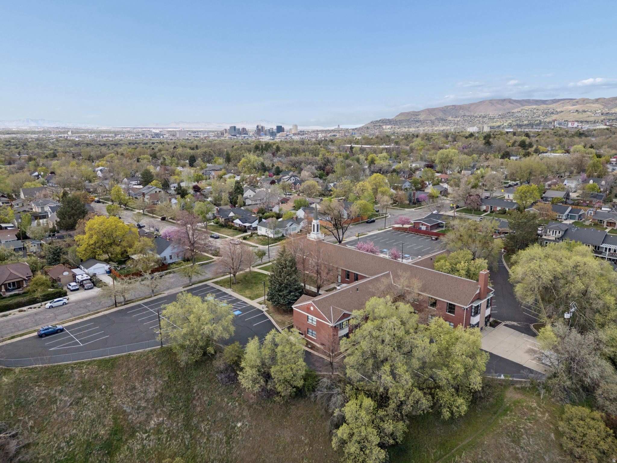 The property located at 1455 South 1700 East in Salt Lake City, Utah features a building with 17,693 square feet of space and sits on 2.53 acres of Institutional-zoned land. Offers will be reviewed after the property owner's mandatory 30-day listing period expires. Zoning and allowed uses must be confirmed with the city.