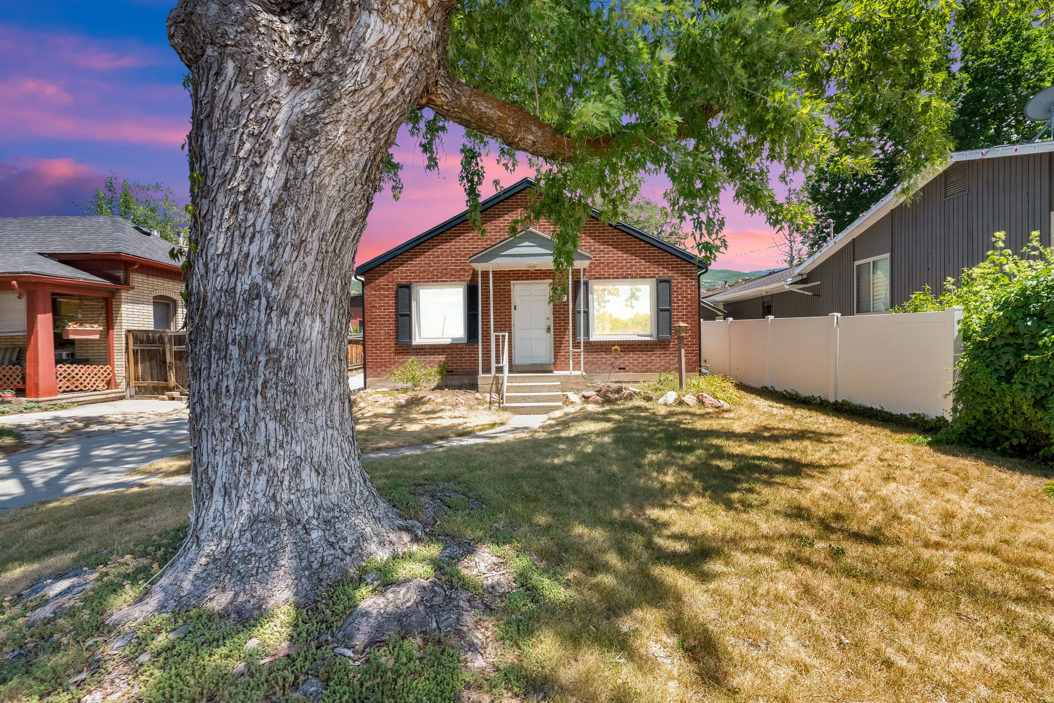 Located on the Bountiful East Bench sits this wonderful brick bungalow. Some mountain and valley views, this great piece of property is just waiting for your personal touches. Some nice updates have already been completed: Newer kitchen, water heater 2018, dishwasher 2020, water softener 2024 and the main sewer line was augured 2022. In 2017 when seller purchases the home, the roof was 4 years old, a new driveway was poured, new siding and insulation was added to back of home with new facia and soffits. Thie home has been well cared for during her ownership and would be perfect for first time home buyer. The home shows a lot of character with it's arched doorways, double paned windows, spacious kitchen with tiled floors, oak cabinets, granite countertops, kitchen dining area, pantry and small mudroom with storage off back door. Two bedrooms with tiled full bath, vessel sink and hallway storage cabinets. Each room has a ceiling fan installed. All appliances included: disposal, refrigerator, range, dishwasher and microwave.  Downstairs has good ceiling height with a bedroom and huge tiled laundry room that has lots of space for additional storage.  The backyard has nice sized deck and lot. Room to build a garage and garden area.  Other special features include gas forced furnace, central air conditioning, electric dryer hookups, 4 to 5 spaces for parking in driveway, washer and dryer and included in sale, water softener, fully automatic sprinkling system, fully fenced backyard, sidewalks, asphalt shingle roof and storage shed.  This home shows "True Pride of Ownership". It's a great value at this price for the area. Don't Miss Out!!