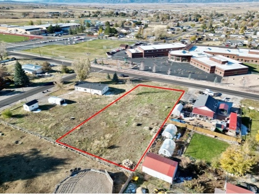Prime .44-Acre lot within City Limits! Build your dream home on this spacious and relatively flat .44-acre lot, ideally located just steps from both the elementary and high school. Enjoy the convenience of in-town living with the added bonus of beautiful mountain views. With utilities nearby and ready-to-build potential, this property offers the perfect blend of location, space, and scenic surroundings. Don't miss this rare opportunity! Pressurized Irrigation is stubbed on the lot. All information within is provided as a courtesy only. Buyer and Buyer's agent advised to complete their own due diligence. Property and lot lines are shown as approximate.