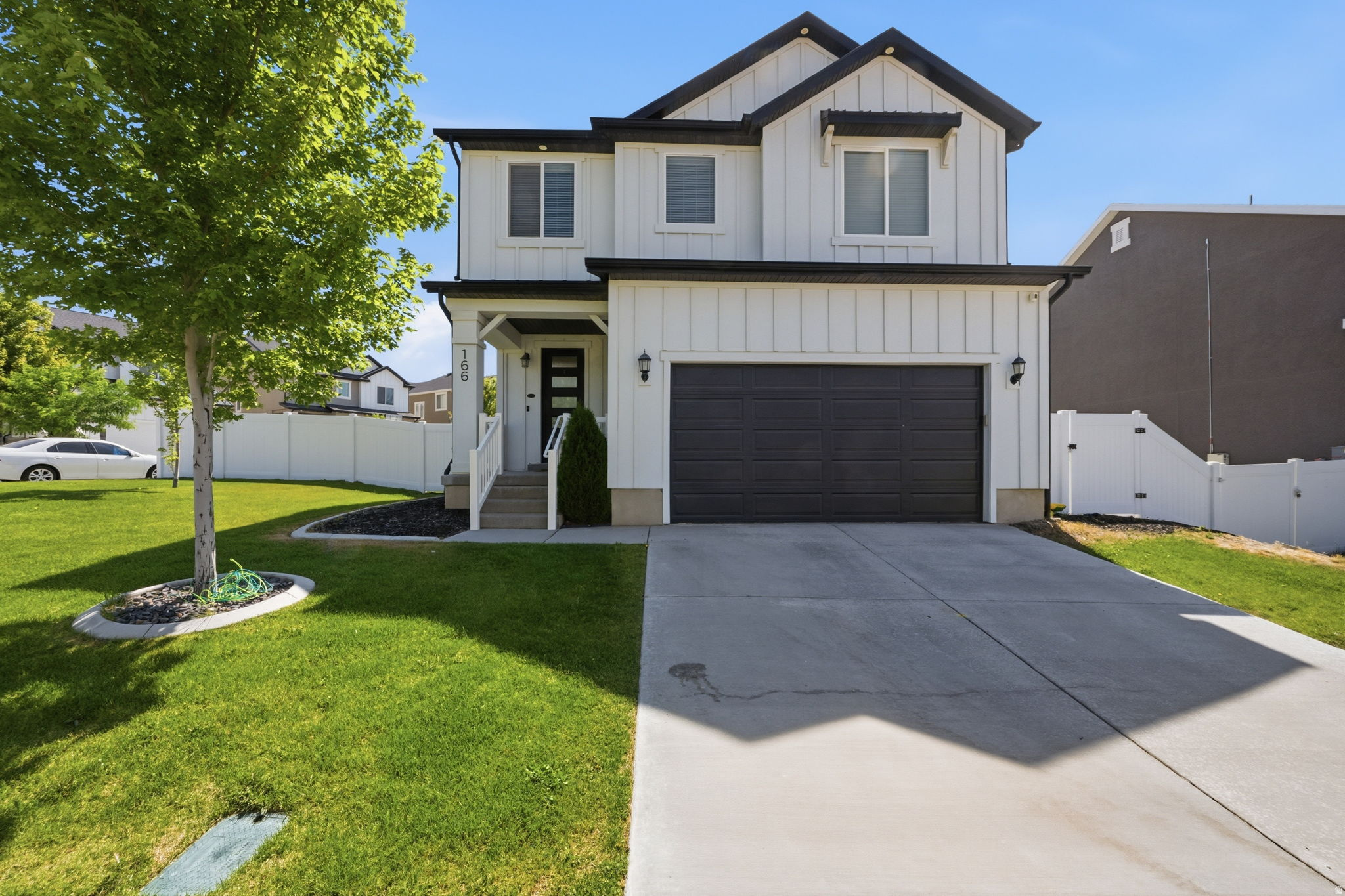 Experience the perfect blend of modern design, thoughtful upgrades, and everyday comfort in this like-new Saratoga Springs home located in the desirable Quailhill community at Mt. Saratoga. Situated on a premium corner lot with wide-open views and easy access to neighborhood parks, pickleball courts, walking trails, and open space, this home offers exceptional value and lifestyle. Inside, you'll find a bright open-concept floor plan enhanced by vaulted ceilings, expansive windows, and automatic shades that fill the home with natural light. The upgraded kitchen serves as the heart of the home, featuring an extended island, abundant workspace, and a spacious walk-in pantry-ideal for entertaining and daily living. The vaulted primary suite provides a private retreat with a luxurious glass-enclosed shower and oversized walk-in closet. Downstairs, the professionally finished basement expands your living space with impressive 9-foot ceilings, a dedicated fitness room complete with rubber flooring and drinking fountain, a theater room that can easily serve as an additional bedroom, and a full bathroom already roughed in for future completion. Over $40,000 in builder upgrades are complemented by additional investments in landscaping, custom window coverings, and basement finishing. Energy-efficient features include solar panels, a tankless water heater, and an insulated garage door, helping reduce utility costs while maximizing comfort. Plus you get a solar system included in the sale, minimizing your electric bill ongoing.  Conveniently located just minutes from schools, shopping, dining, and recreation, this move-in ready home offers the rare combination of modern construction, extensive upgrades, energy savings, community amenities, and flexible living spaces. A truly exceptional opportunity in one of Saratoga Springs' most sought-after neighborhoods.   Buyer to verify all information. Grass color enhanced in photos due to winter dormancy.
