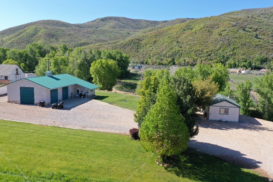 BIG PRICE REDUCTION! Super Unique opportunity on 10 Acres at the base of a mountain! Enjoy lush alfalfa, a large grass field, and a seasonal mountain stream! Breath in the mountain air and breath taking views! You'll be hard-pressed to find a property like this one! This property is currently on the greenbelt! Lots of wildlife frequent the area including elk, deer, turkeys, ducks, geese, and other birds of various kinds. There's plenty of space to add on to the current home or build your dream home if desired. This home is situated in an area that is very close to blue ribbon fisheries and lots of public land to pursue deer, elk, and moose. World renowned ski resorts are nearby and mountain biking opportunities are endless. Horses and livestock are welcome. There are endless trails that surround the area as well for your UTV's. Tons of storage for all your toys in the 39'X39' insulated metal building with RV Hookups for family and guests. 3/4 Finished bathroom in the shop. Also, there's a 16X24 Finished shed with heat and air known as the "Music Room" shown in the pictures! Another 18'X 30' building that's got a 1 car garage with carport capacity for tractors and other farm equipment. So much potential... Place to live while you build the home of your dreams toward the front of the property! Only minutes to the Heber City Airport! So many possibilities! Don't miss this rare opportunity to own a truly unique piece of paradise in the Heber City Valley and Wasatch back!