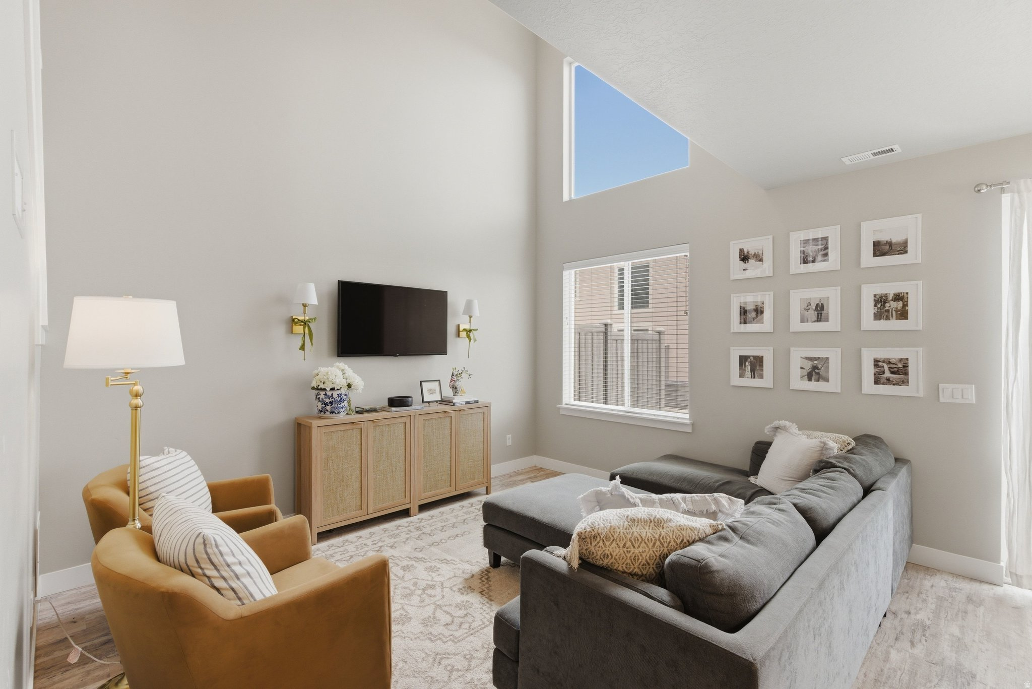 Vaulted ceilings on the main floor and in the spacious primary suite are just the beginning of what sets this 2021 Lakeview Fields townhome apart from the standard build. The thoughtfully designed primary bathroom features an oversized shower, double sinks, and a large walk-in closet, while a tankless water heater adds efficiency and convenience. Situated on the quieter western edge of the community, this home offers a layout that lives larger than its square footage suggests. Additional highlights include a 2-car garage and a convenient half bath on the main floor. Enjoy easy access to miles of running, walking, and biking trails, while still being just minutes from I-15, shopping, dining, and everyday conveniences. This is low-maintenance living with upgraded features and an ideal location. Square footage figures are provided as a courtesy estimate only and were obtained from county records. Buyer is advised to obtain an independent measurement.