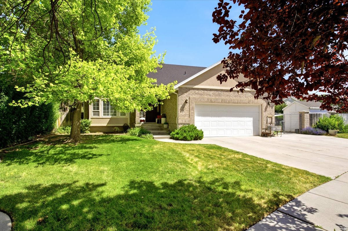 Welcome to this beautiful home located in a quiet cul-de-sac in Brigham City! The open floor plan features a spacious family room with a cozy fireplace that flows right into the kitchen, making it a great space for everyday living or entertaining. Wood laminate flooring adds both style and easy maintenance. Step outside to enjoy the large, private deck overlooking the fully landscaped yard. There's plenty of room to relax, and the storage shed is included. The spacious primary suite offers a large walk-in closet and a private bathroom, providing a comfortable place to unwind at the end of the day. If you're looking for a well-maintained home in a peaceful neighborhood, this one is definitely worth a look!