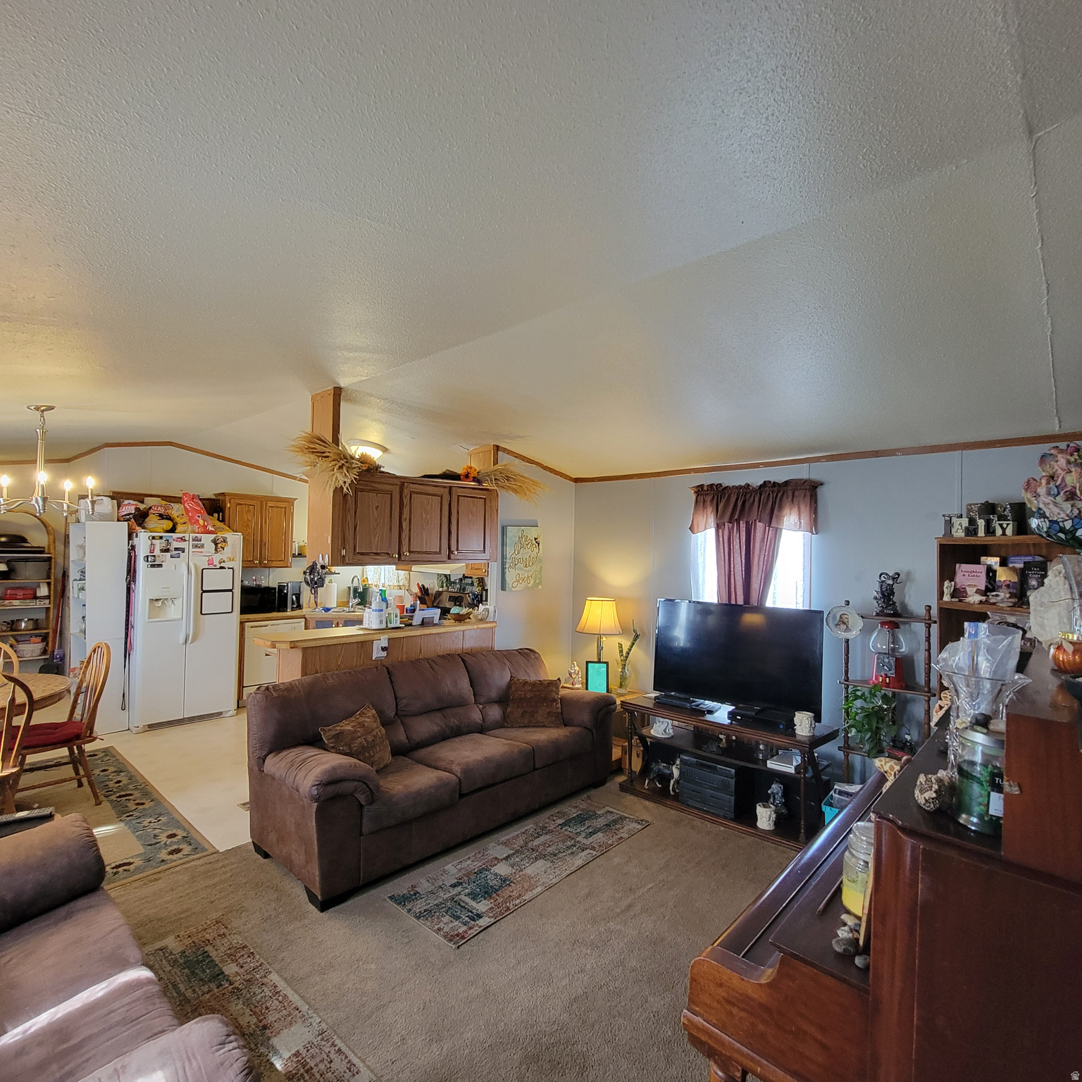 Centrally located 3-bedroom, 2 bath, manufactured home in desirable community. Features Furnace and Central Air installed approximately 5 1/2 years ago. Fenced yard, perfect for pets. Off street parking for 3 vehicles. One side of home a master suite with full bath. The other side 2 bedrooms and a full bath. Open feel in living room - kitchen area. Tall ceilings. Deck area outside of front door. Area for small garden. The park features pool, clubhouse, and parks. Close to shopping, schools, and beautiful view of the mountains. A great place to make your home. Equal Housing Opportunity
