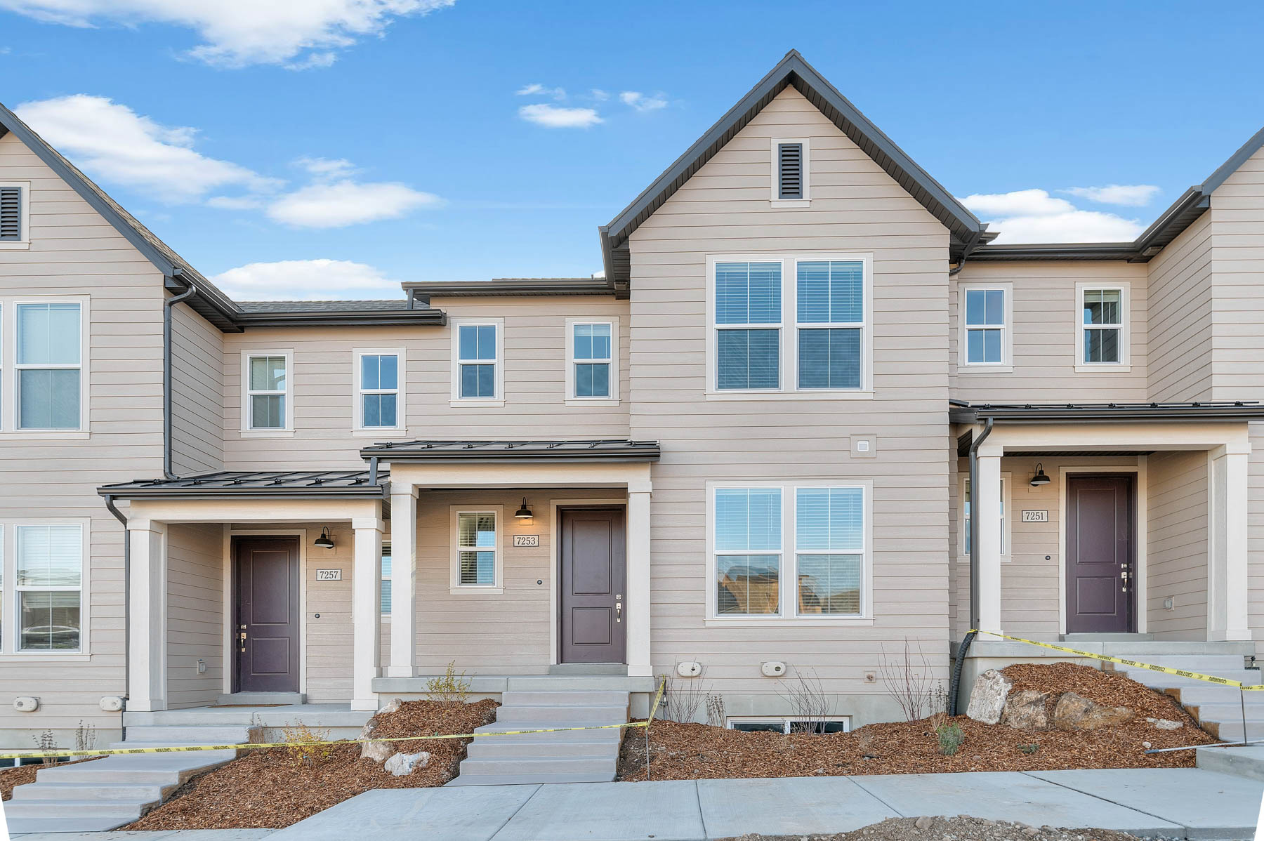 Step into this beautiful Keetley Town Home - where thoughtful design meets modern comfort! This home features a stylish kitchen with gray maple cabinets paired with quartz countertops, designer tile backsplash and platinum gas appliances that elevate your culinary experience. Laminate hardwood, vinyl tile, and carpet flooring ensure both beauty and practicality throughout. The home showcases a spacious feel with a half wall at the stairway, large Craftsman base and casing, and two tone paint for a warm, finished look. The owner's bathroom includes cultured marble shower surrounds and is accented with satin and brushed nickel hardware for a clean, elegant touch. A perfect blend of function and style, that comes fully landscaped and maintained by the HOA, the Keetley is move-in ready home waiting just for you, all at a great price!