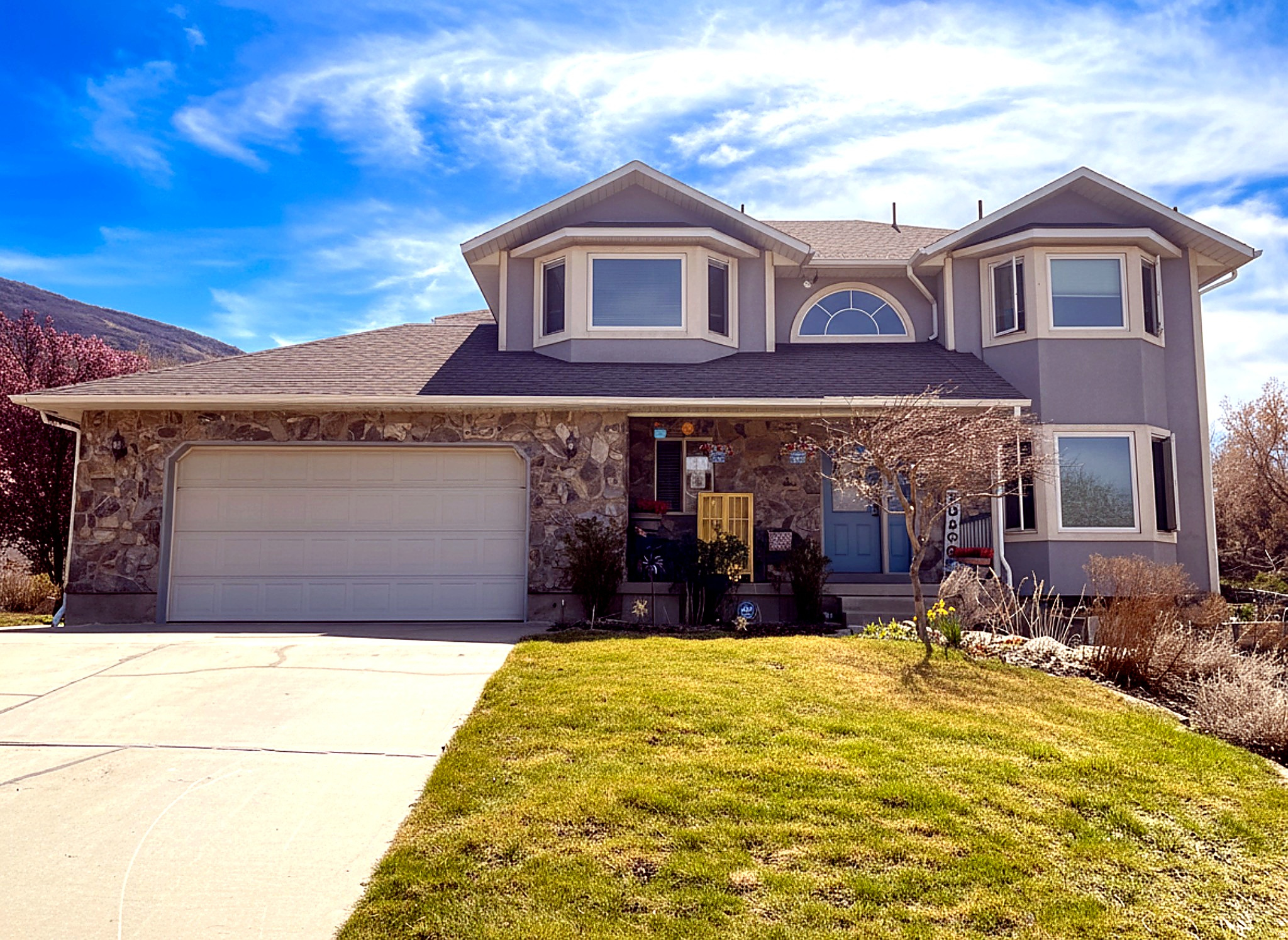 Beautiful custom built two story home on the East Bench of South Weber on .43 acre. Open floor plan.  Kitchen with 3 ovens, and beautiful granite counter tops.  Stainless steel dishwasher, and stove are included.  New lpv flooring in kitchen and in basement.  Brand new boiler and water softener. New carpet on first and second floor.  Great room with fireplace that opens up to an amazing deck and patio with built in natural gas fire pit.  Large shed in backyard to hold all of your extra stuff! Kid's play/tree house included. Master bedroom with fireplace and French doors opening up to a second story deck.  ADU/Walk out basement with kitchenette, stove, laundry, and fridge included.  Apartment has its own backyard space and driveway for renters, or use it for your extra toy parking.  Both upstairs bathrooms have updated quartz countertops and sinks. Ducted swamp coolers  as well as brand new mini splits that have heat and A/C installed on every floor to distribute air throughout the home.  Radiant heat.  Large raised vegetable garden beds in back yard, (9) 3 year old fruit trees, greenhouse., Large garage with work bench and storage loft. So many extras!  Square footage figures are provided as a courtesy estimate only and were obtained from county records.  Buyer is advised to obtain an independent measurement.