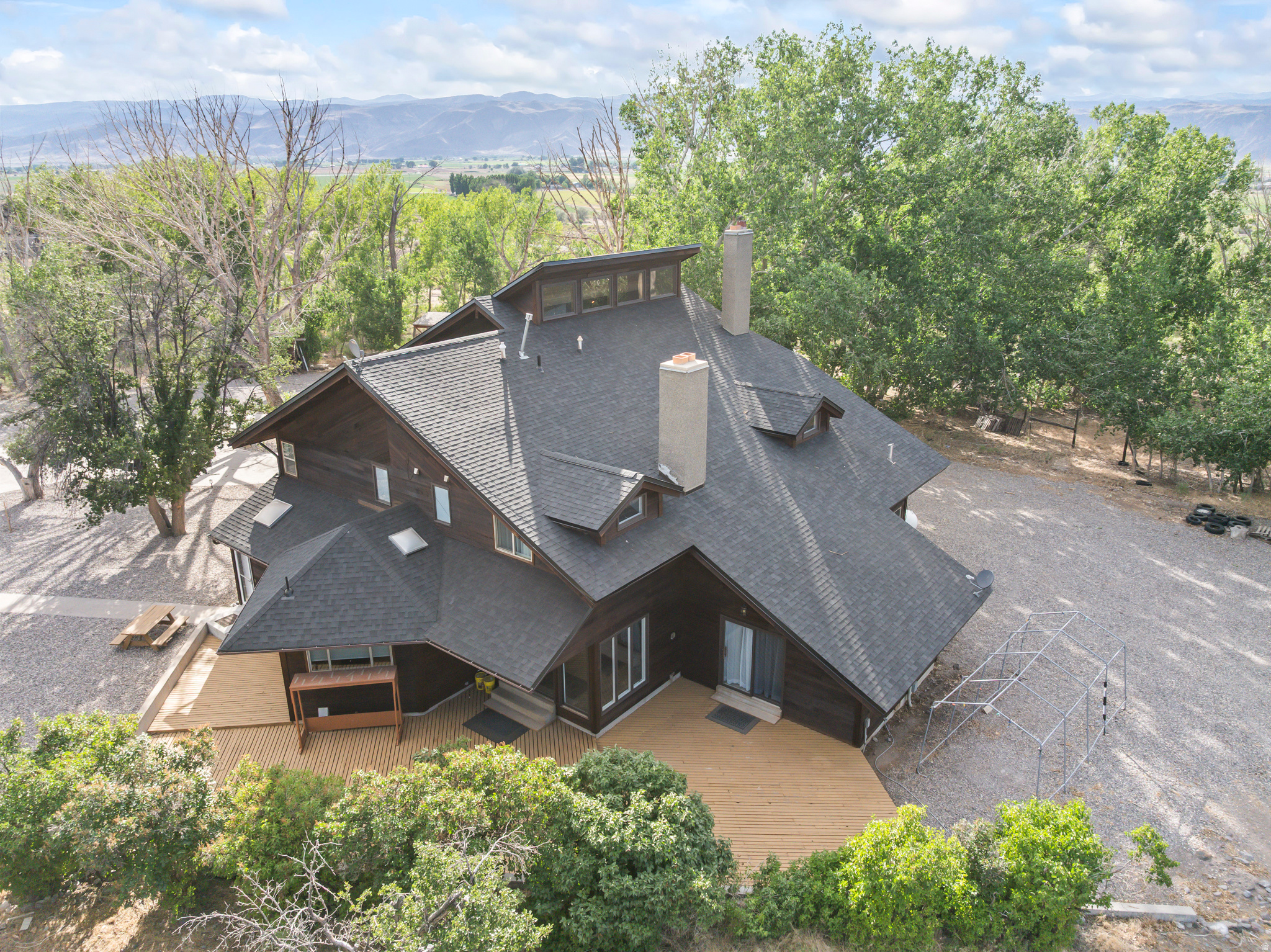 Welcome to Spring Tree Ranch, one of Central Utah's most extraordinary private estates. Situated on 23.95acreson foothills of Central Valley, this remarkable property combines timeless craftsmanship, rich local history, luxury living, and direct access to endless outdoor recreation. From the moment you enter, you'll discover architectural details that simply cannot be duplicated. The home features soaring wood-vaulted ceilings, breathtaking stained glass windows sourced from historic churches, and three stunning fireplaces-including one in the formal living room, one in the spacious primary suite, and another in the cozy den. The entertaining area also includes a charming woodburning stove that creates a warm and inviting atmosphere year-round. History comes alive in the custom bar, featuring the original witness stand salvaged from the historic Richfield Courthouse, creating a conversation piece unlike anything you'll find in another home. The beautifully updated kitchen offers modern convenience while maintaining the home's timeless character. A spacious formal dining room and multiple gathering spaces make this property ideal for hosting family celebrations, holiday gatherings, or entertaining guests. Outside, Spring Tree Ranch offers 23.950acres of open land, providing endless possibilities for horse enthusiasts, hobby ranching, or simply enjoying your own private retreat. Bring your horses and design the equestrian setup of your dreams with plenty of room for barns, arenas, corrals, and pasture. Outdoor enthusiasts will love the property's direct access to BLM land, allowing you to ride your horses, ATVs, or UTVs straight from your property without loading a trailer. Experience thousands of acres of scenic riding trails, mountain adventures, wildlife, and year-round recreation right from your own backyard. Whether you're searching for a luxury horse property, private ranch, recreational retreat, family estate, or a one-of-a-kind home with unmatched character, Spring Tree Ranch offers an opportunity that rarely comes to market