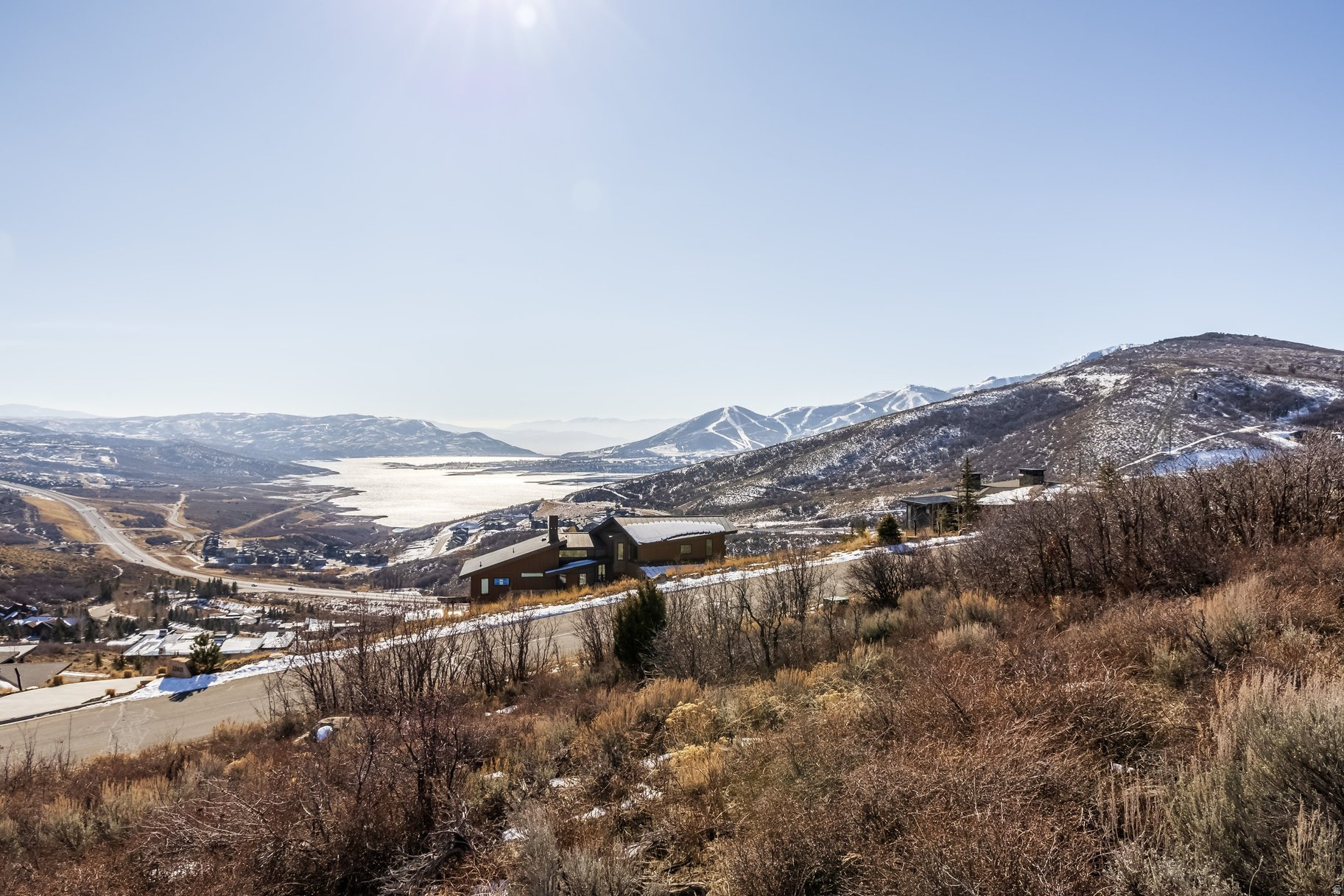 Looking for a residential lot in Deer Vista with Jordanelle and Deer Valley views? Welcome to 13610 N Deer Canyon Drive: a 1.16-acre uphill homesite offering wide-open panoramas of Jordanelle Reservoir, Deer Valley, and the surrounding peaks. Set in the private, gated community of Deer Vista, this lot backs to HOA open space and is just 10 minutes from Park City and Deer Valley Resort. All utilities are stubbed to the lot in this well-established neighborhood, and a full set of building plans designed by Habitations is available. Ideal for the family who dreams of building their custom mountain home, or builders looking for their next high-end spec project.  Deer Vista is a luxury mountain neighborhood with a welcoming social spirit. With a great mix of primary and second home owners, residents enjoy endless recreational activities, dinners, book clubs, and neighborhood events that foster connection. Compared to some local golf communities, Deer Vista offers a relaxed lifestyle with lower HOA dues and million-dollar views in every direction.