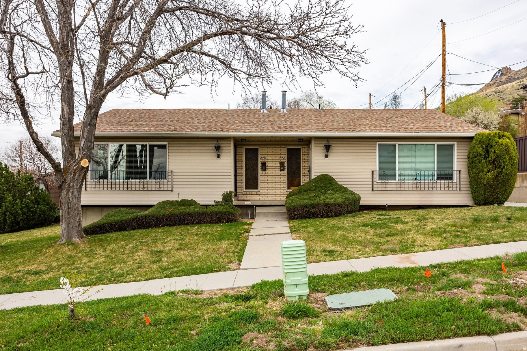 This charming brick duplex is ideally positioned on the east bench in one of Salt Lake City's most accessible and desirable locations. Situated above Foothill on a quieter stretch of 2100 South, this property offers exceptional convenience without the typical congestion, along with a long private drive providing both privacy and ease of access. Each unit includes a covered carport space and an additional dedicated parking spot. Both units are thoughtfully laid out with two bedrooms and two bathrooms, featuring one bedroom and bath on each level along with generous gathering spaces that create a comfortable and functional flow. Spacious kitchens allow for informal dining, and each unit is equipped with private, in-unit laundry. Both units are currently vacant, providing immediate flexibility for owner-occupants or investors to lease at today's market rates. Pricing reflects current rental market projections of approximately $1,975 per unit per month rather than prior below-market rents previously achieved by the seller. With the University of Utah academic year just concluding, the upcoming leasing cycle presents a timely opportunity to capture fresh tenant demand. The property has been well maintained and offers strong rental potential, with great proximity to the University of Utah, downtown Salt Lake City, the international airport, and some of the area's best outdoor recreation including nearby canyons and trail systems. A large front and backyard provide rare outdoor living for a property of this type, including patio areas where each unit can enjoy space for dining, grilling, or relaxing.