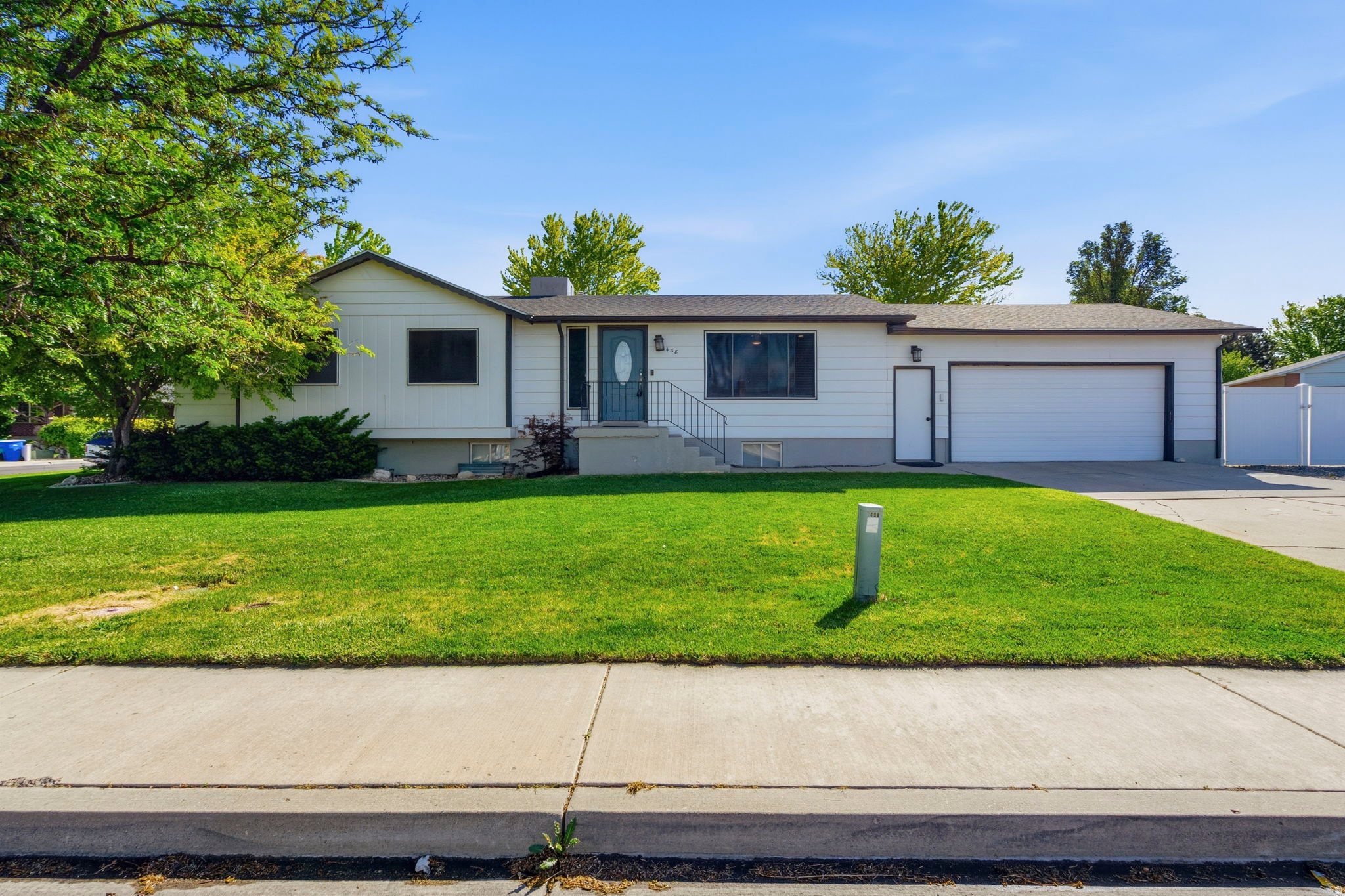 You asked for a Rambler home on a terrific lot with a HUGE RV parking area, close to the freeway in a great neighborhood... Here it is!  Welcome home to this Lehi rambler on a spacious corner lot with room to live, gather, store, park, and enjoy. The main level offers a comfortable, functional layout with 2 bedrooms and 2 bathrooms, including an updated kitchen that feels fresh, inviting, and ready for everyday living or entertaining.  The finished basement adds even more flexibility with 2 bedrooms, 1 bathroom a large family room, basement dry bar, second laundry room, and a huge storage room that is hard to find and easy to appreciate. Whether you need space for movie nights, guests, hobbies, food storage, holiday decor, or a home gym setup, this home gives you options. Outside, the fully fenced backyard offers a large yard with plenty of room to play, garden, entertain, or relax. The extra wide and extra long RV parking is a major bonus, along with a huge shed with power for tools, toys, equipment, or additional storage. With radiant heat, a desirable rambler layout, and a convenient Lehi location, this home offers the space and practicality buyers are looking for.