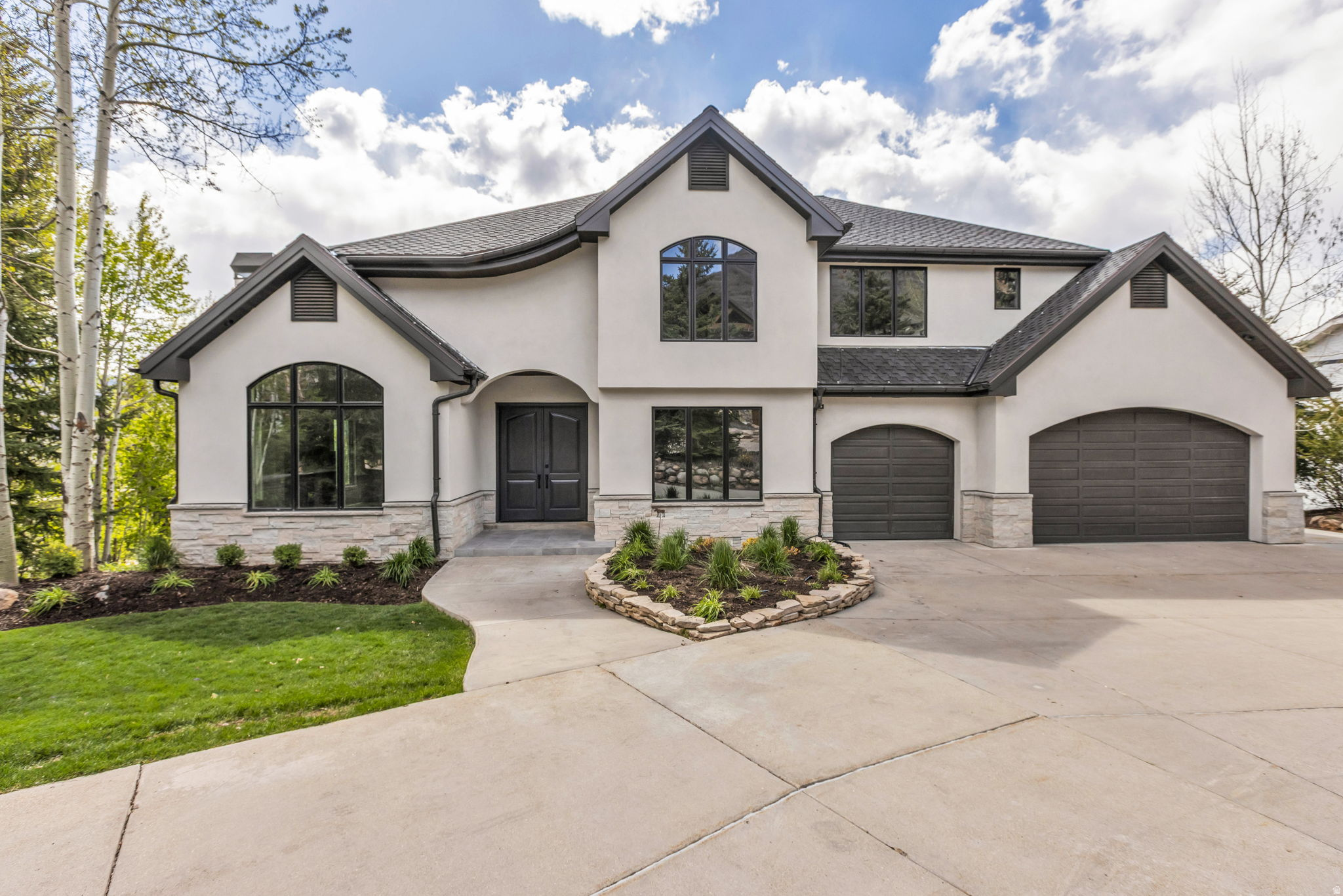 Located in the highly desirable Jeremy Ranch community of Park City, this fully remodeled home offers a rare combination of modern design, stunning views, and unbeatable convenience. Set on a premier lot overlooking Jeremy Ranch and the Wasatch Mountain range, the property captures expansive mountain vistas and abundant natural light throughout. The home has been completely transformed with a new roof, full exterior renovation, updated landscaping, and all-new mechanical systems, creating a truly turnkey living experience.  Inside, an open-concept floor plan is designed for both everyday living and entertaining, featuring a brand-new chef's kitchen, updated bathrooms, new flooring, paint, doors, lighting, and appliances. Four fireplaces add warmth and character, while the spacious primary suite offers a luxurious retreat with a generous bedroom and beautifully appointed bathroom.  Outdoor living is equally impressive, with a large deck ideal for entertaining and enjoying the surrounding views, complemented by mature landscaping that enhances privacy and curb appeal. A three-car garage provides ample storage for vehicles and gear.  Located directly across from a trailhead accessing the popular Flying Dog trail system, the home offers immediate access to hiking and biking, while also providing quick freeway access for an easy commute to Salt Lake City. This is a rare opportunity to own a fully renovated home in one of Park City's most sought-after neighborhoods.