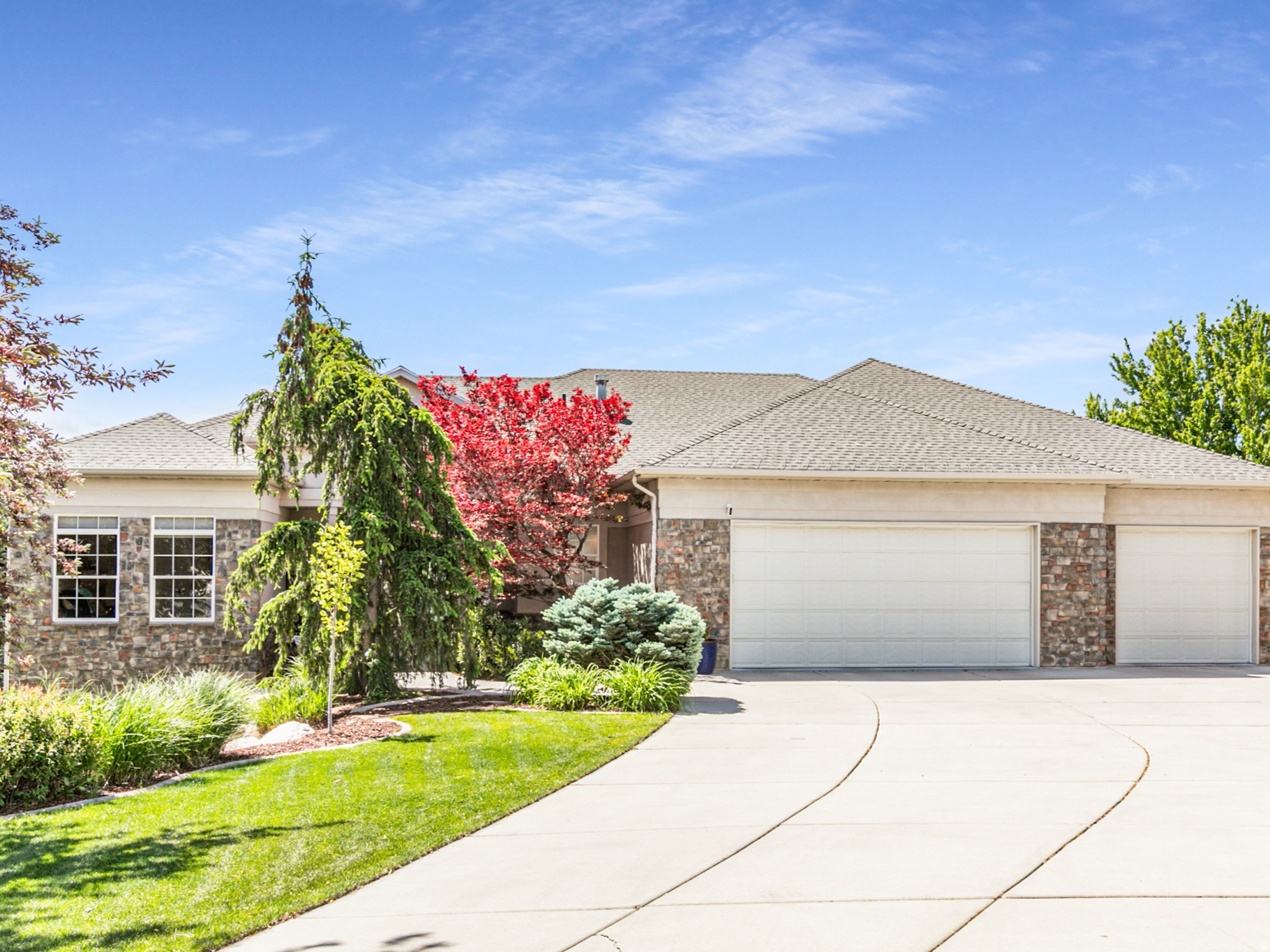 Peaceful North Ogden living with incredible mountain and valley views! Backing to a nature park with no homes behind, this quality-built custom home offers breathtaking views of Ben Lomond, The Great Salt Lake, and Coldwater Canyon - including a direct view of "The Major" Veterans Day flag display. Expansive windows throughout the home were perfectly positioned to capture the stunning scenery and natural light from nearly every room. The spacious layout offers comfortable living and gathering spaces for family and guests alike. The fully finished basement features soaring 13-foot ceilings and oversized windows that make it feel bright and open - nothing like a typical basement. Enjoy trails and parks nearby, peaceful quiet surroundings, and BenLomond right out your front door. Additional highlights include a large shop space with exterior access, perfect for hobbies, storage, or workspace needs. A rare combination of privacy, views, and craftsmanship in one exceptional North Ogden home.