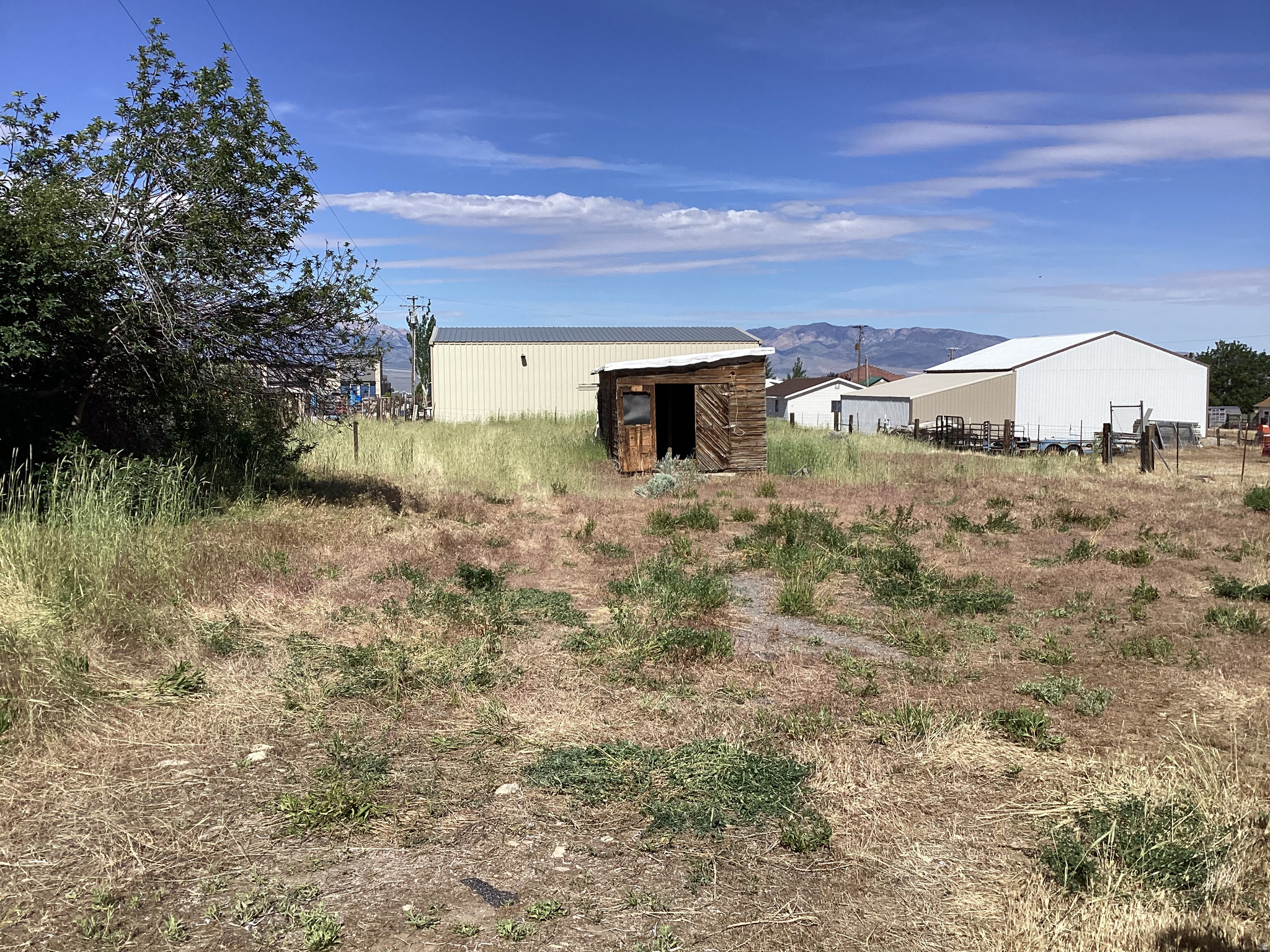 Rare half acre HORSE PROPERTY on the West side of Tooele. The manufactured house has been removed. I will update pictures today. All utilities are already there, and ready for you to build your dream home. This is a quiet, peaceful neighborhood, with friendly neighbors. LDS church 300 feet to the North, and a beautiful view of the Deseret Peek Temple a couple miles away. Zoning is RR-1. Agent/Owner.