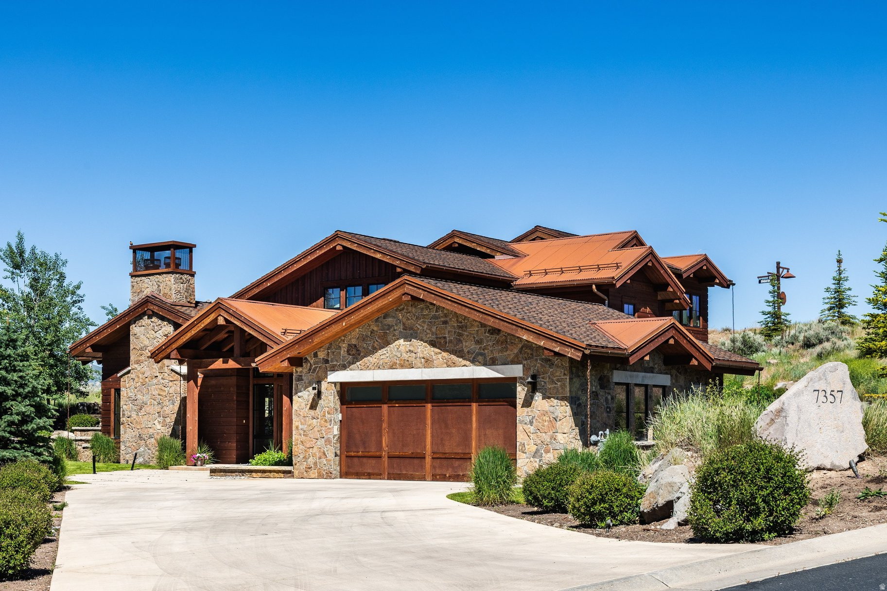 This exceptional custom home at Victory Ranch offers the ultimate year-round mountain retreat, just steps from the brand-new golf clubhouse with dining, golf, events, and more. Designed by renowned architect Greg Steffensen and masterfully built by Quilter Construction, the home showcases gorgeous architecture, thoughtful design, and quality craftsmanship throughout. With six spacious bedrooms, there's plenty of room to welcome family and friends in comfort and style. Outdoor living shines with a private, cozy hot tub, an outdoor kitchen, and inviting dining spaces-perfect for relaxing or entertaining after a day on the course or exploring the Ranch. A rare opportunity to own a luxury home that blends proximity, privacy, and timeless design in one of Victory Ranch's most desirable locations. Victory Ranch is a private, four-season community amidst 6,250 pristine acres along four miles of the Upper Provo River. Amenities include an 18-hole Rees Jones golf course, world-class fly-fishing, miles of mountain biking and hiking trails, 5-stand shooting facility, 4x4 adventures, snowmobiles, ice skating rink, backcountry yurts, fishing ponds, multiple restaurants, a ski-in/ski-out lodge in Park City and more than 3,500 acres of untouched backcountry. The Post Clubhouse includes our concierge, heated pool, hot tubs, fire pit and seasonal grill. Our newest amenity, The Barn, features a Pizza and Ice Cream Parlor, Art Studio, Game Room and Indoor Basketball and Sport Court as well as a Fitness Center, and Spa. The new swimming pool, waterslide, tranquil stream and pond, tennis, pickle and paddle courts, and event lawn will be sure to provide hours of family fun. Victory Ranch is approximately 15-minutes from Deer Valley and 25 minutes to Park City.