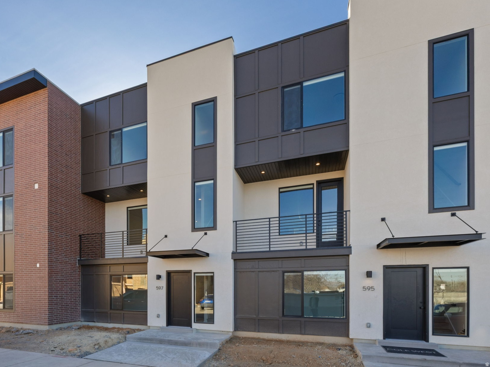 Modern living at theMONROE! This Type B2 interior townhome is Built and standing - perfect timing to secure a brand-new home in one of Salt Lake's most desirable communities. This thoughtfully designed floorplan offers 3 bedrooms, 3 bathrooms, and a 2-car garage, with a bright, open-concept main level that seamlessly connects the kitchen, dining, and living areas. A private balcony extends your living space, creating the perfect spot to relax or entertain. The home will feature designer-selected finishes throughout, including quartz countertops, modern cabinetry, stylish lighting, and durable flooring, all curated to create a clean, contemporary feel. Enjoy low-maintenance living with convenient access to downtown Salt Lake City, shopping, dining, and major commuter routes. Community amenities include a pickleball court and nearby green space, offering both lifestyle and location. Photos are of previously built unit; finishes and selections may vary.