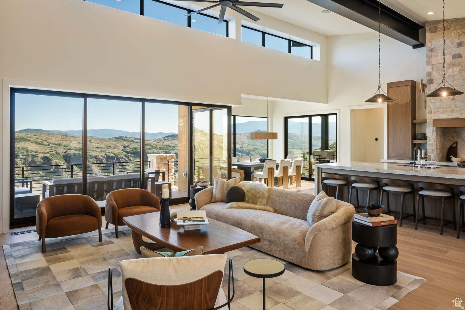 This stunning 2025 Park City Parade Home sits above the Jordanelle Reservoir, neighboring Victory Ranch and the new Marcella East development. Perfectly located, it's just 5 minutes from the Jordanelle boat ramp, 15 minutes to Deer Valley's East Village, and a short drive to Heber, Kamas, and both the Uintas and Wasatch mountains. Designed in a warm Mountain Modern style, this brand-new custom home offers sweeping valley and lake views from every bedroom and living space. The home includes 5 spacious en-suite bedrooms, 3 outdoor decks, a private office, and a 3-car garage with ample storage space. At the heart of the home is a chef's kitchen featuring a butler's pantry & its own prep sink, Sub-Zero refrigerator/freezer, Wolf range with double ovens, custom white oak cabinetry, and 10ft island with Taj Mahal Quartzite countertops. A 4-panel sliding door connects the main living area to the deck, creating seamless indoor-outdoor living. Thoughtful details include plaster fireplaces in the family room and primary suite, a stone fireplace in the basement, and a floating metal staircase with white oak treads. The primary suite highlights a spa-like bath with a wet-room shower/tub, radiant heated floors, quartzite counters, and a custom walk-in closet. Additional highlights: Built-in Sonos sound system throughout, Epoxy-finished garage floors, Basement kitchenette, Water filtration system, TVs included in the family room, primary suite, and lower level, A perfect blend of luxury, comfort, and mountain living. ** LIST PRICE INCLUDES FURNITURE **