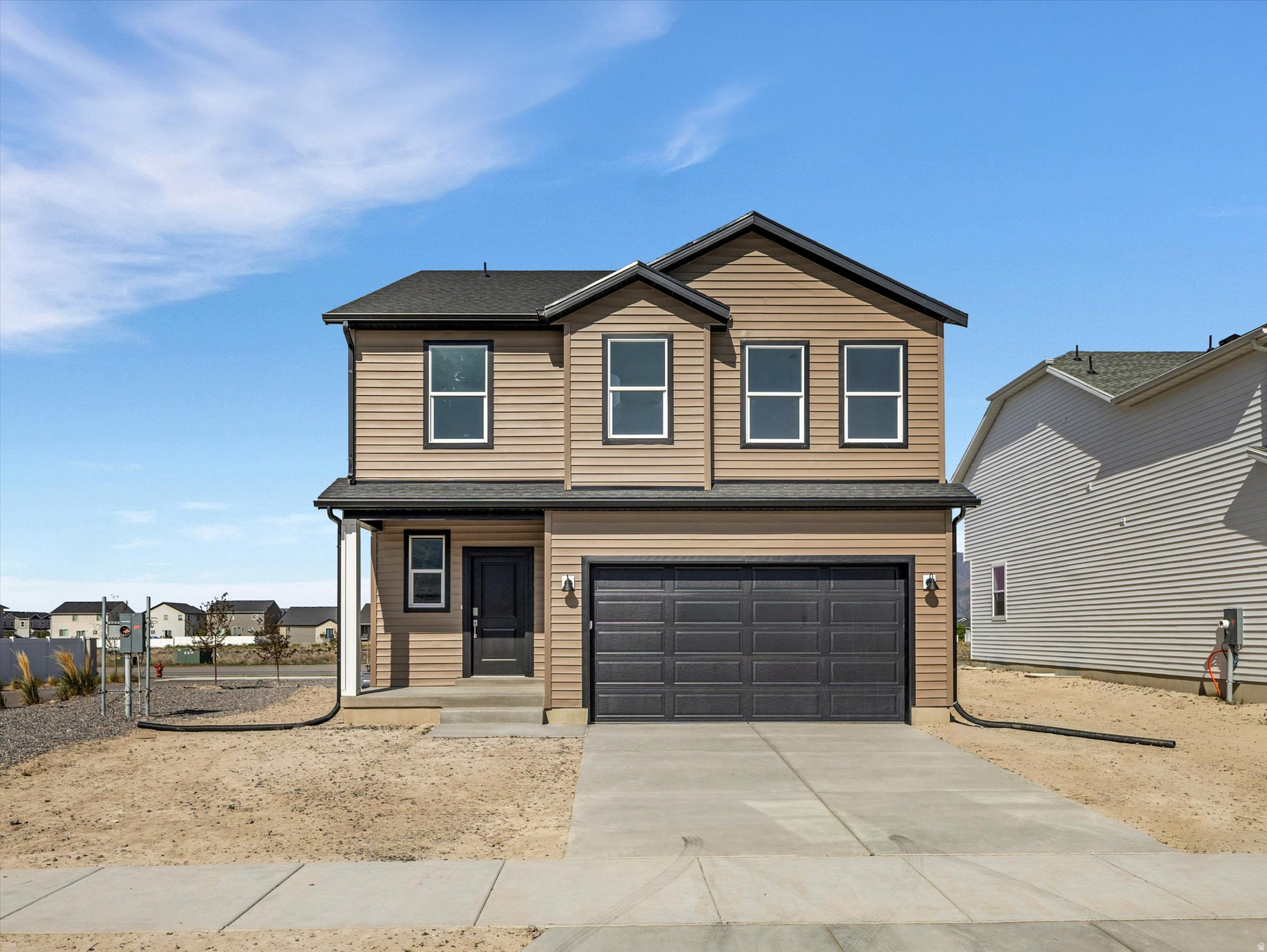 READY FOR ITS NEW HOMEOWNERS!!! Introducing the Paisley floor plan, beautifully designed New Construction home in the up and coming part of Eagle Mountain with NO HOA! This thoughtfully crafted layout features 9-foot ceilings on the main floor and an open-to-below concept that fills the home with natural light. The kitchen showcases Quartz countertops, a LARGE kitchen island perfect for gathering, and a seamless flow into the dining area with a pop-out design for your dining room table that adds charm and functionality. Upstairs, you'll find three spacious bedrooms designed for comfort and privacy. The unfinished basement is ready for your vision! Whether you're dreaming of additional living space, a home gym, or extra bedroom, the potential is ALL yours! Complete with a two-car garage, energy efficient construction, and located in a growing spot of Eagle Mountain you will LOVE all the New shopping choices, restaurants and schools nearby. Come see this home TODAY! Easy to show and see!