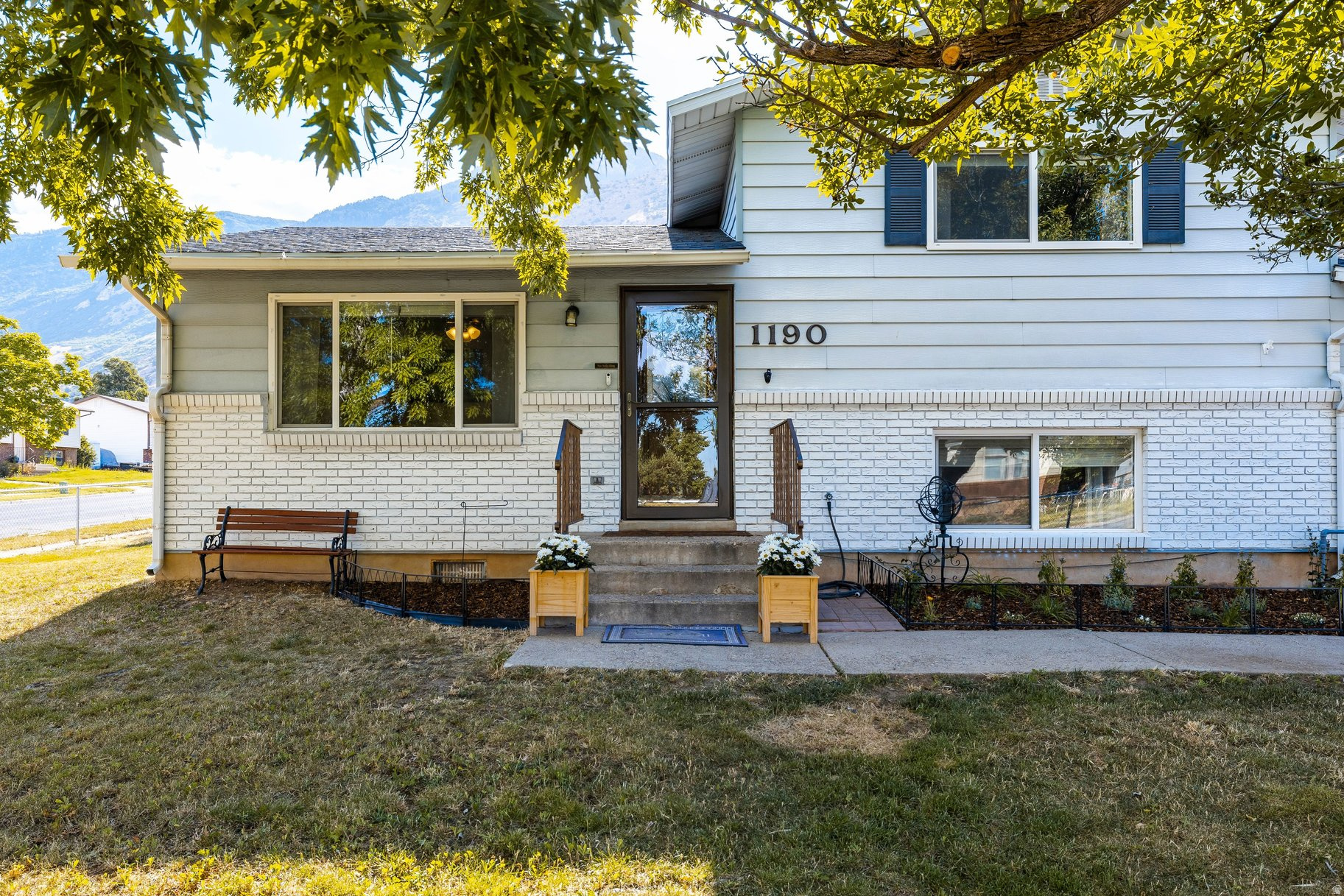 Welcome home to this meticulously maintained residence, thoughtfully updated and ready for its next chapter. Situated on a spacious corner lot with beautiful mountain views, the home is filled with abundant natural light, creating a warm and inviting atmosphere from the moment you step inside. Its functional layout makes it an excellent choice for first-time buyers, growing families, or anyone seeking a move-in-ready home.  Recent improvements include a new roof (2016), added concrete patios for outdoor entertaining, raised garden boxes with irrigation, a new garage door, fresh interior paint, new carpet throughout, and updated kitchen appliances-just a few of the many enhancements that reflect the pride of ownership found throughout the property.  Ideally located within walking distance of Lincoln Elementary School and Mount Lewis Park, you'll also enjoy quick access to numerous hiking and biking trailheads just minutes away. Experience everything Ogden has to offer, from its vibrant downtown farmers markets, art festivals, and the beloved Harvest Moon Celebration to year-round outdoor recreation. World-class skiing is just 30 minutes to Snowbasin Resort and approximately 37 minutes to Powder Mountain, making this an ideal home base for Utah's four-season lifestyle.