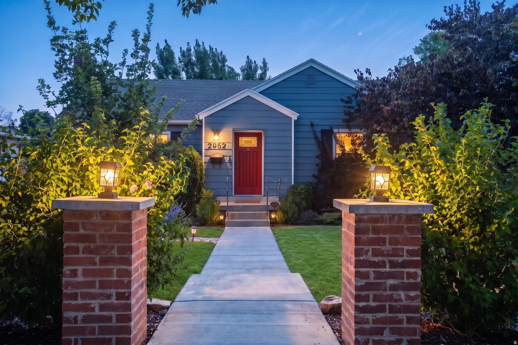 Tucked behind classic brick pillars and mature landscaping, this Highland Park bungalow pairs vintage charm with a thoughtful renovation from top to bottom. A sun-filled, open layout welcomes you in, anchored by a fireplace and a picture window in the living room that frames the front yard beautifully. Original hardwood floors run throughout the main level. The kitchen brings style and substance together with an oversized granite island, custom cabinetry, a gas range, stainless appliances, and a bold tile backsplash. Two comfortable bedrooms and a full bathroom with double sinks round out the main floor. The lower level offers real flexibility with a large family room, two additional bedrooms with egress windows for natural light and safety, a dedicated laundry room, and a full bathroom with a garden tub and separate walk-in shower. Ideal for guests, a home office setup, or extra family space. Outside, a freshly landscaped backyard and covered patio create an easy spot for morning coffee or evening entertaining. A one-car garage adds everyday convenience. Location you can't beat - walk to Sugar House Park and Salt Lake Swim and Tennis, with quick freeway access to downtown and the ski resorts.