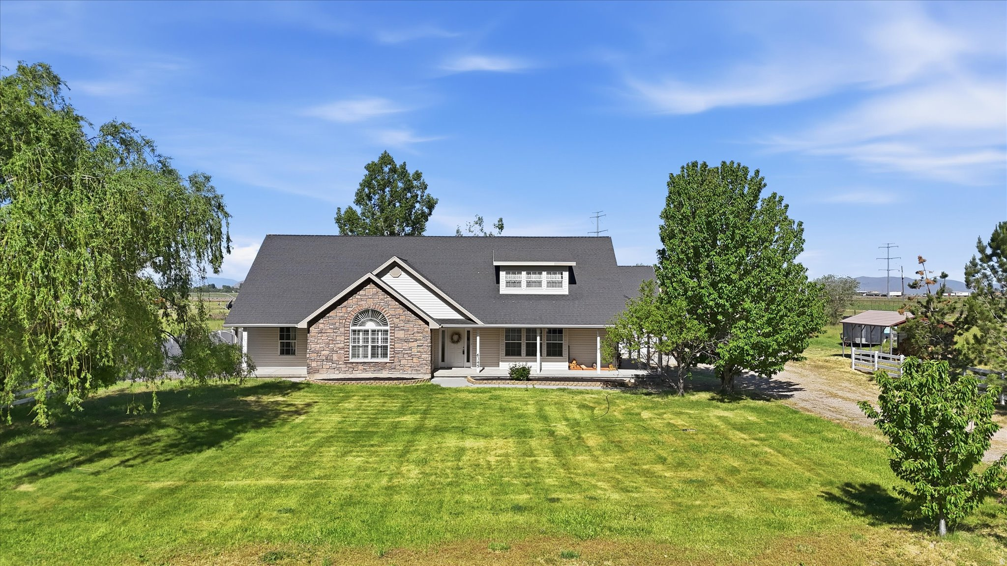 Country living with functionality and charm! This horse property includes fenced pastures ready for animals, mature shade trees that add character and comfort, and a versatile shop with a cement floor. Perfect for hobbies, storage, or agricultural use.