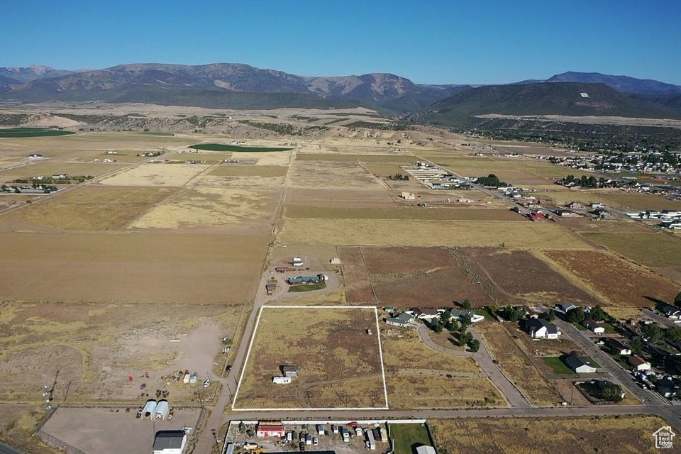 3.5 Acre Commercial Lot with Mountain Views - Prime Location Near Main Street Don't miss this rare opportunity to own 3.5 acres of commercial land in a highly desirable location just off Main Street. With sweeping mountain views and utilities nearby, this property is ready for your vision.  Utilities: Power is stubbed in. City water and sewer lines run in the road. Buyer will need to provide a 1955 or older water right to connect to city water.  Accessibility: Excellent access with close proximity to Main Street, making it ideal for a variety of business uses.  Restrictions: A deed restriction allows for only a single-story structure to be built on the east half of the lot or a multiple story on the west half.