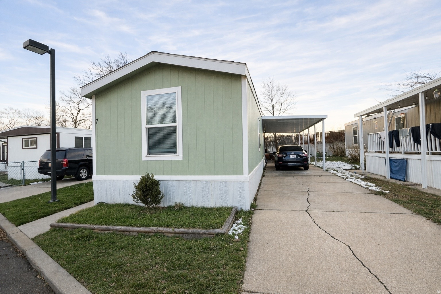 2017 manufactured home - rare newer build in the community. 3 bed, 2 bath with open layout, central A/C, covered patio and carport parking. Refrigerator and range included. Buyer must be approved by park. Lot rent applies.
