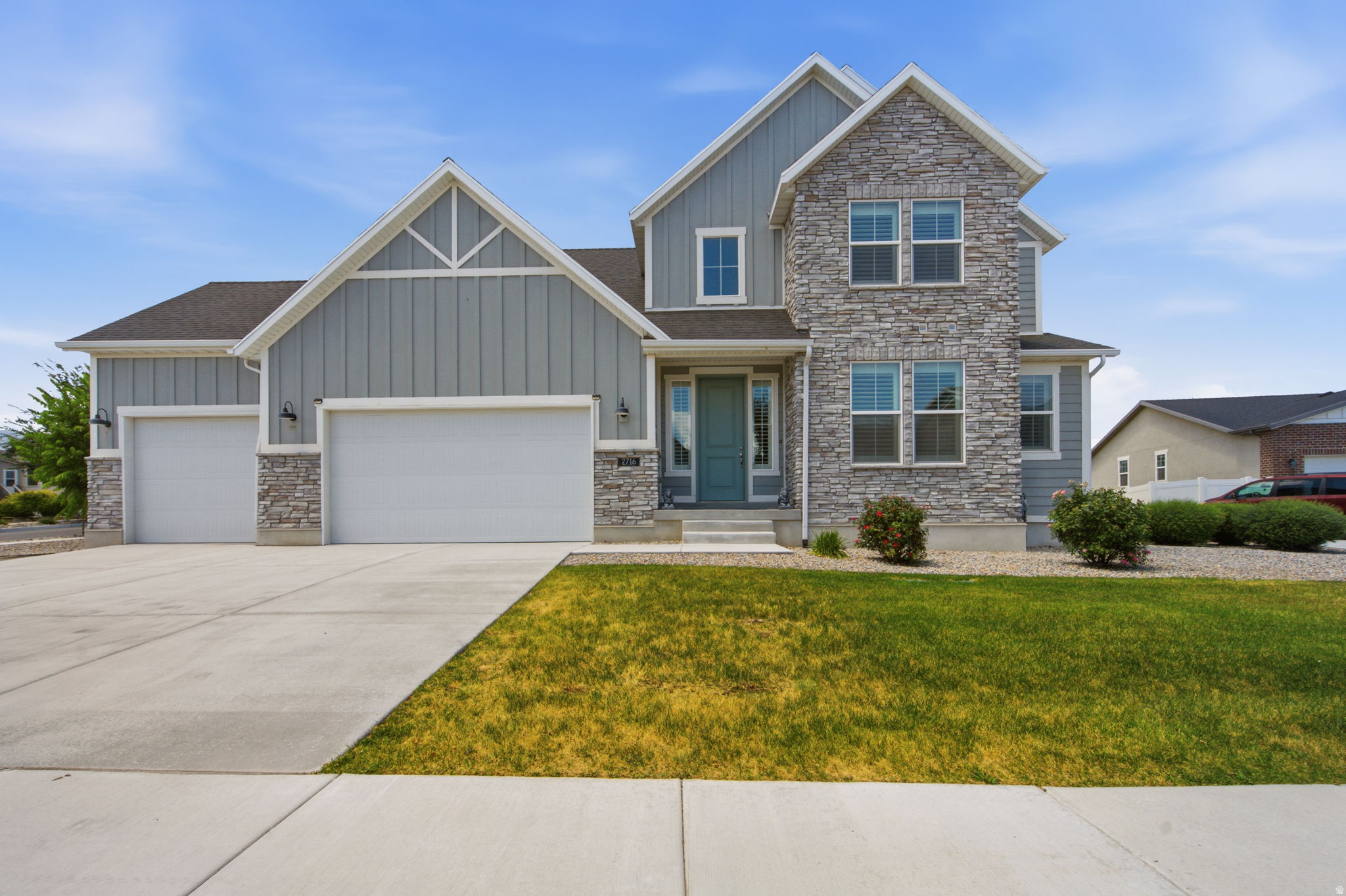 Welcome to this spacious farmhouse-style home located in one of Magna's growing master-planned communities. With a large, functional layout, this home offers plenty of room for everyday living, entertaining, working from home, or multi-generational needs.  Inside, you'll notice the open feel right away with higher-than-standard ceilings and taller interior doors, giving the home a more elevated and spacious feel without being vaulted. The home also features bright box bay windows, quartz countertops, stylish white cabinetry, stainless steel gas appliances, laminate hardwood flooring, can lighting, two-tone paint, and chrome hardware throughout. The grand bathroom includes cultured marble surrounds, adding a clean and polished finish.  Outside, enjoy the convenience of a 3-car garage with keypad entry, along with HOA-covered landscaping maintenance for easier upkeep. Located in a growing area of Magna with nearby community amenities, this home offers space, style, and long-term comfort all in one.