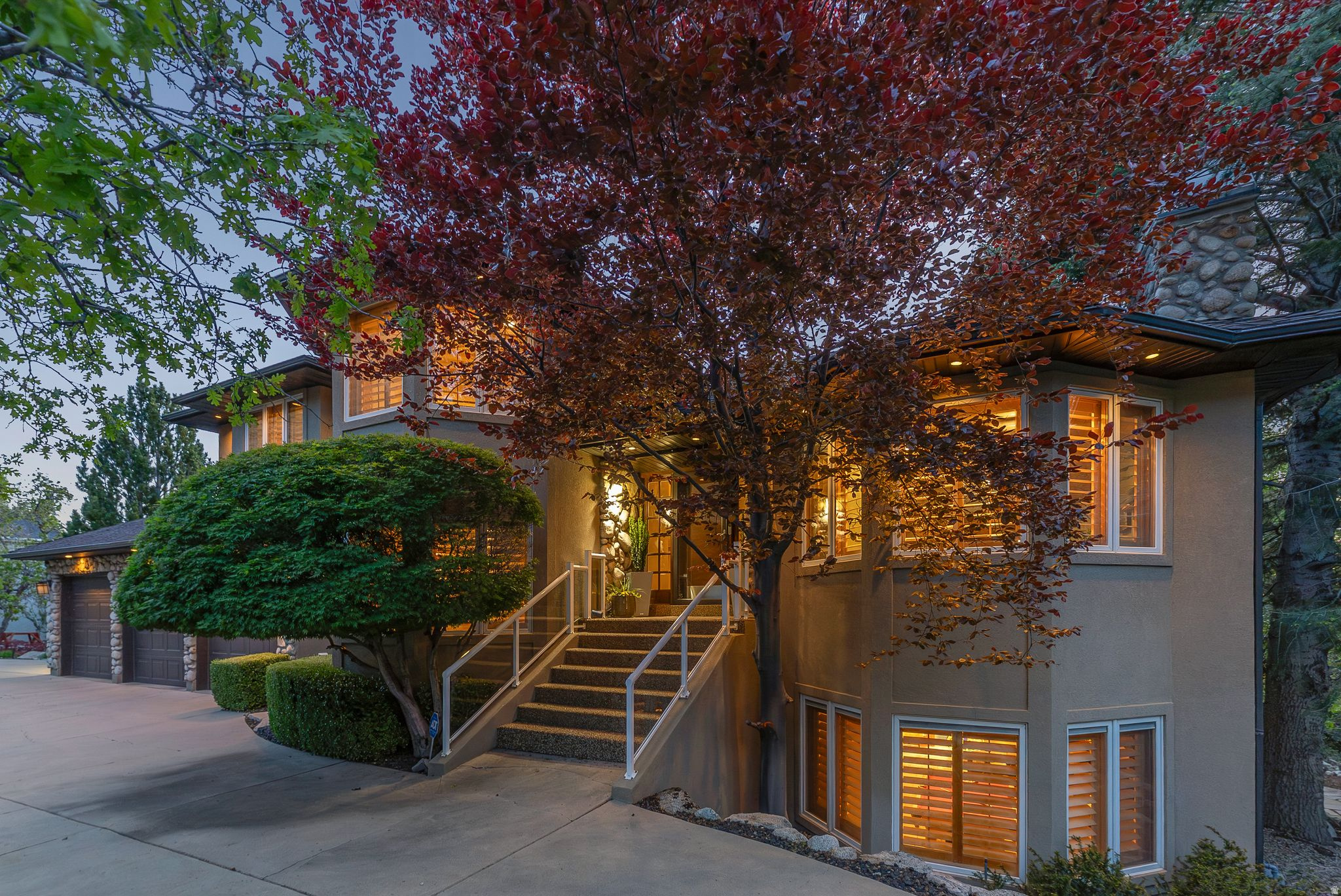 Located on the East Bench of Sandy and just minutes below Hidden Valley Park, this home offers privacy, mountain access, and expansive valley views. The setting provides quick access to nearby trails and frequent wildlife while still being close to city amenities. This home has been extremely well cared for and features custom finishes throughout. The kitchen includes Wolf appliances, custom barstools, and radiant floor heating throughout the home. Amenities include a large office on the main floor, wet bar, theater room, gym, and steam shower. Multiple outdoor decks extend the living space across several levels, complemented by custom landscaping that creates a private outdoor oasis. An additional storage room accessible from the outside and located on the side of the home adds full functionality. Square footage figures are provided as a courtesy estimate only and were obtained from County Records and on-site measurement. Buyer is advised to obtain an independent measurement.