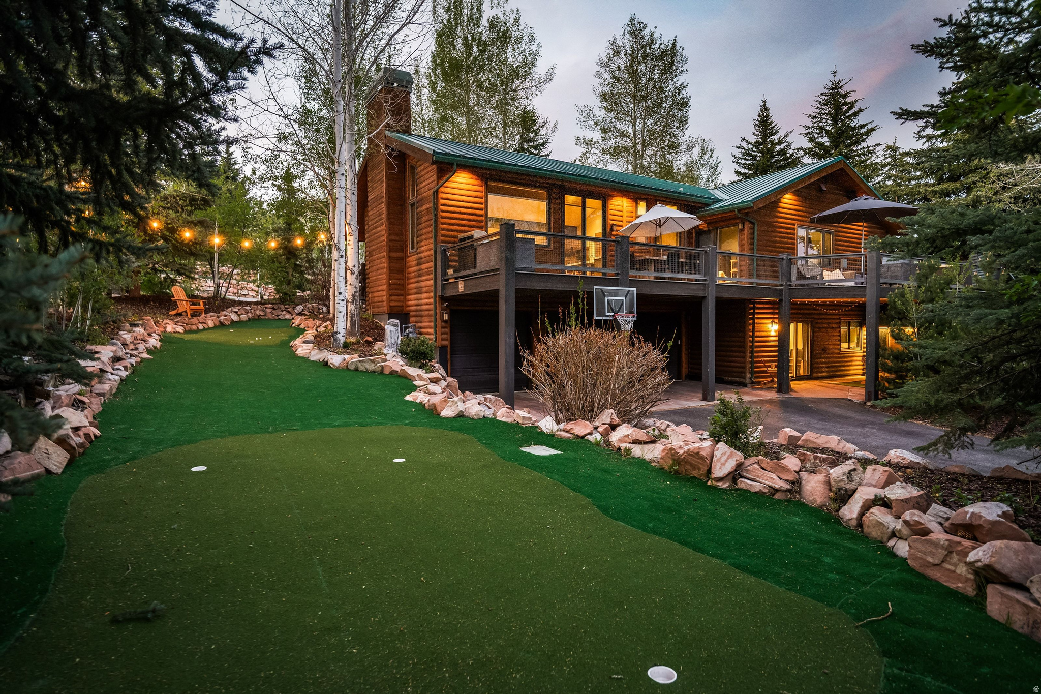 Perfectly positioned on a quiet cul-de-sac in one of Park City's most convenient year-round neighborhoods, this beautifully updated mountain home offers the ideal blend of full-time livability, vacation-home flexibility, and immediate access to everything Park City is known for. Located just minutes from Deer Valley Resort, Park City Mountain, Canyons Village, Main Street, golf, hiking and biking trails, restaurants, shopping, and Salt Lake International Airport, this is an exceptional opportunity for both full-time families and second-home buyers.  Thoughtfully designed with vaulted ceilings, expansive windows, and warm mountain-modern finishes, the home features generous gathering spaces, multiple living areas, and seamless indoor-outdoor flow ideal for entertaining after ski days, summer concerts, or weekends in the mountains. The spacious kitchen opens to comfortable dining and living spaces designed for year-round enjoyment.  The private primary suite offers a true mountain retreat, while additional bedrooms provide flexibility for guests, children, work-from-home setups, or vacation rental potential. A coveted 3-car garage provides ample storage for vehicles, skis, bikes, golf clubs, and all the gear that comes with the Park City lifestyle.  Surrounded by outdoor recreation and just moments from skiing, private clubs, Woodward Park City, Whole Foods, and endless trail systems, this home delivers the convenience, lifestyle, and long-term value luxury buyers are searching for in today's Park City market.