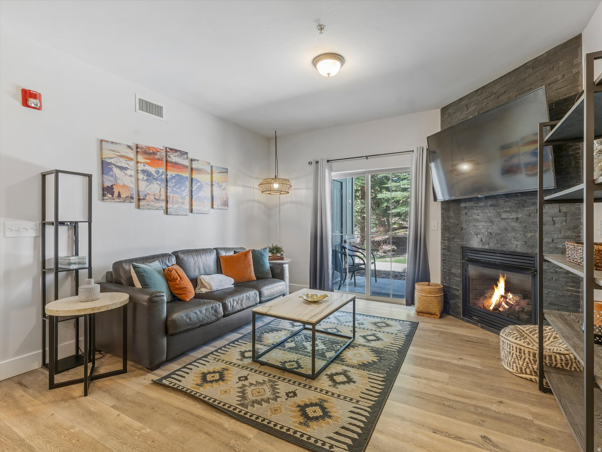 Perfectly situated Bear Hollow Condo. End Unit, Ground Floor. This beautifully updated 3-bedroom, 2-bath residence offers easy Park City living in amenity-rich Bear Hollow Village. Nightly rentals are allowed. Just steps from the resident-exclusive hot tub, this turnkey property is being sold fully furnished and ready to enjoy or generate income. The inviting living space features a stunning floor-to-ceiling stone gas fireplace, luxury LVP flooring, Nest thermostat, and abundant natural light. The kitchen is appointed with granite countertops and flows seamlessly into the open-concept living and dining areas. The spacious primary suite includes a large soaking tub, separate shower, and thoughtful finishes throughout. Enjoy outdoor living on the covered patio with extra storage closet as well as the convenience of a heated garage with assigned parking and additional storage closet. Throw in the water softener for appliance longevity and there is not much left to upgrade. HOA dues cover water, sewer, garbage, internet, cable, landscaping and amenities. Located on the Free Bus Route and backing to Olympic Park, this pet-friendly community offers exceptional amenities including a clubhouse with pool, spa, gym, and great room. Just 12 minutes to world-class skiing and 25 minutes to the airport, this is the perfect full-time residence, vacation home, or investment opportunity. Vacant and Easy to Show. Contact Agent for Details.