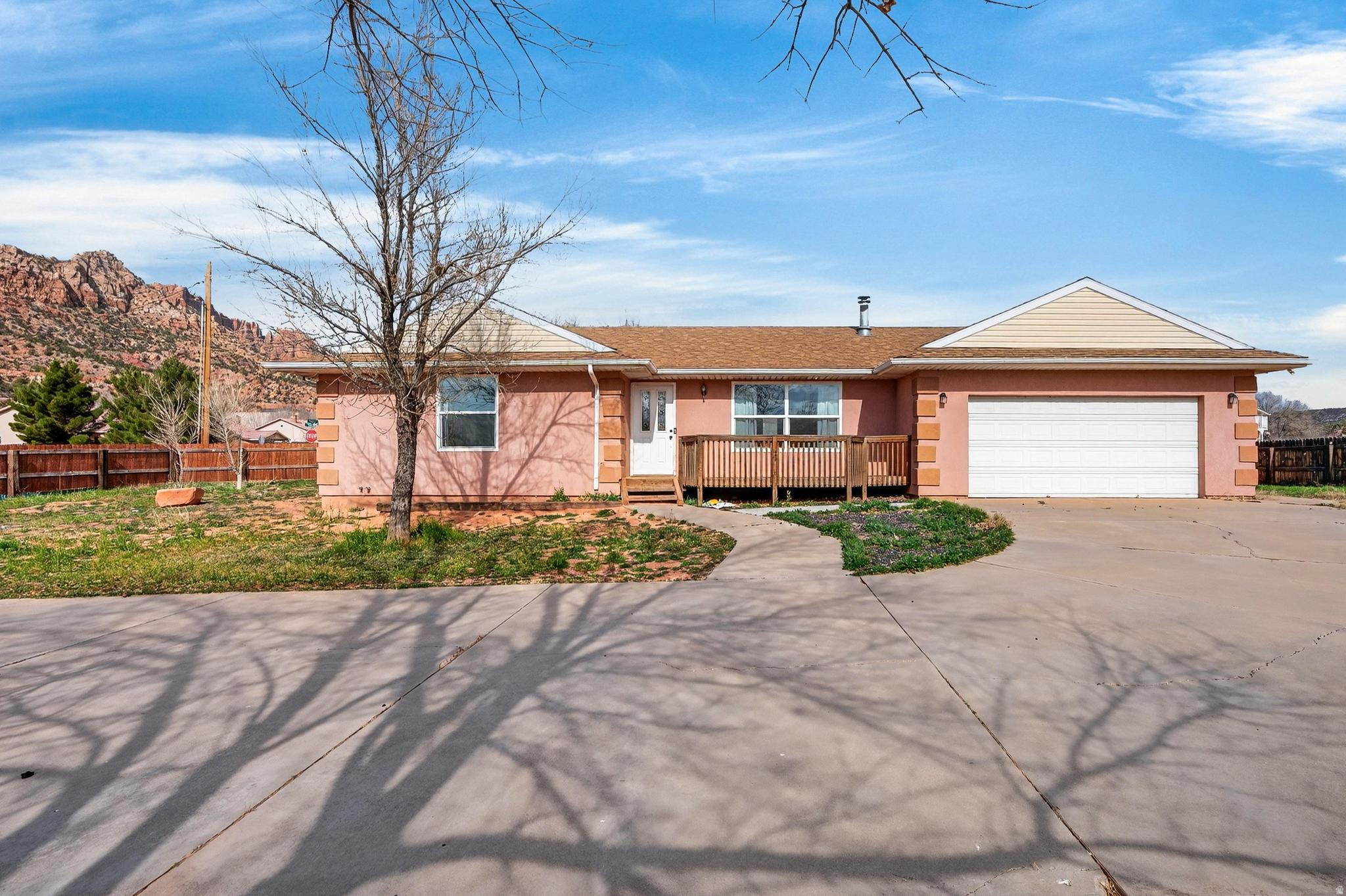 Welcome to this beautiful open floor plan home on over-half-acre corner lot with stunning Red Mountain views. Step into a cozy living room with a charming wood-burning stove, perfect for relaxing evenings. The kitchen has been refreshed with brand-new cabinetry and offers lots of storage, including a large walk-in pantry/storage room that could easily be converted into a third bedroom. Features 2 bedrooms and 2 bathrooms, with recent updates throughout including new flooring, new carpet, some fresh paint, and a remodeled primary bathroom. Enjoy outdoor living from the patio while taking in the scenic views, plus the convenience of RV parking with hookups. Located near hiking, biking, and ATV trails, next door to a coming-soon community park, and close to schools, this property is ideal as as a starter home, investment opportunity, or peaceful retreat with room to grow.