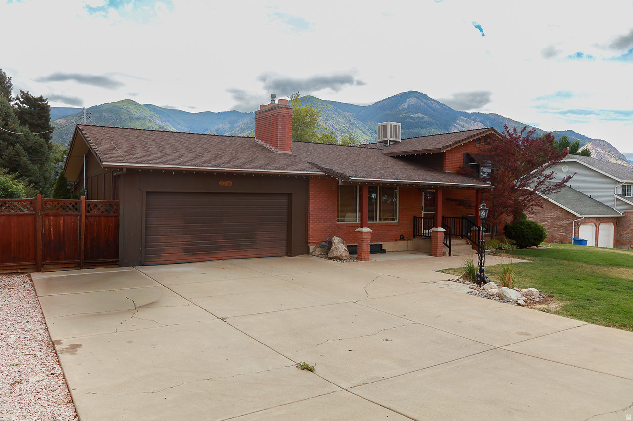 Well-built 3-bedroom, 2-bath North Ogden home on nearly a half-acre lot with beautiful mountain views. Features include living and family rooms, a dining area, large laundry room, covered deck, mature fruit trees, 2-car garage, and full automatic sprinklers on secondary water. Enjoy the space and privacy of a larger lot while being just minutes from shopping, restaurants, hiking, biking, Pineview Reservoir, Snowbasin, Powder Mountain, and Ogden Canyon recreation. Buyer to verify all.