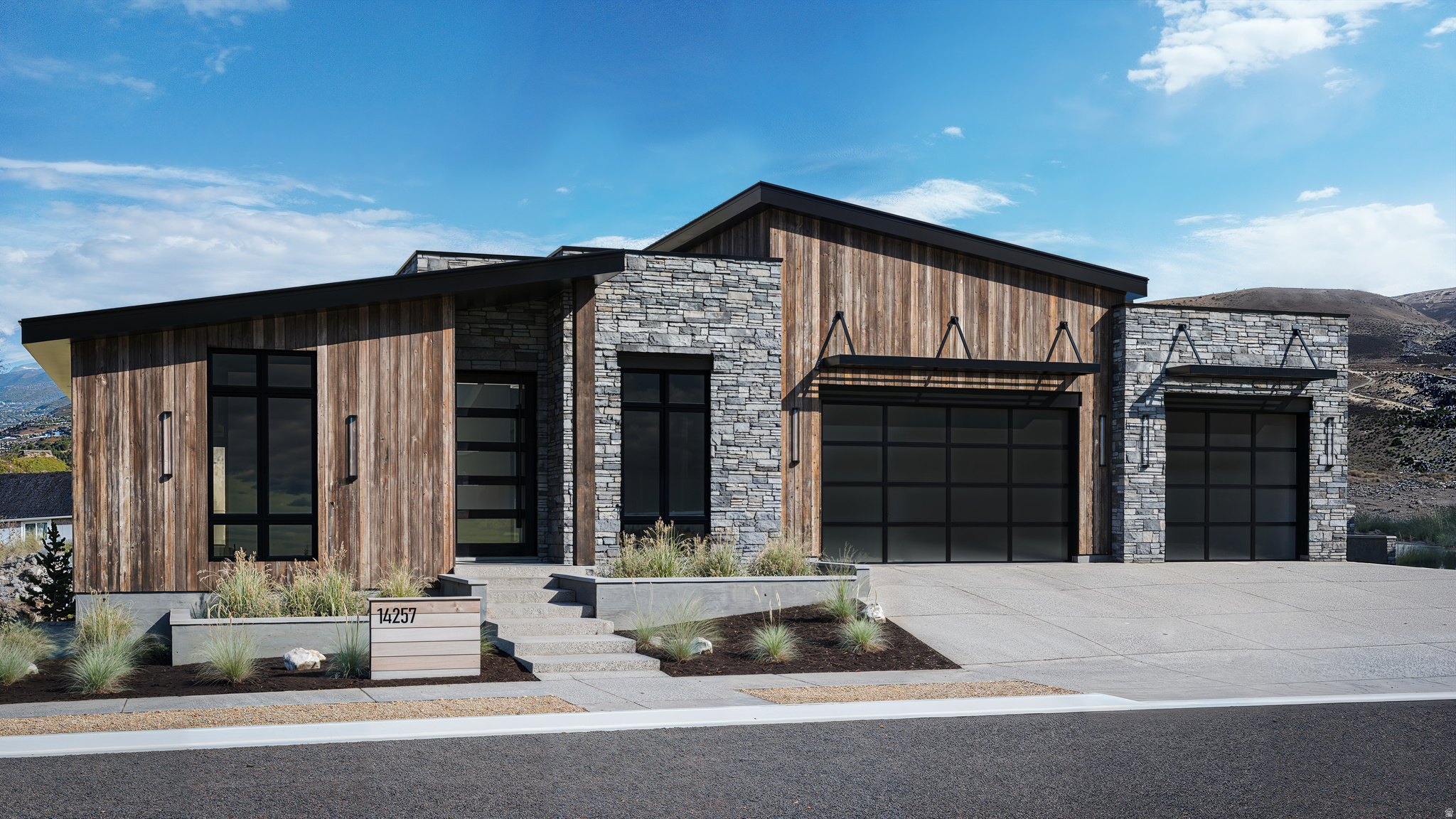 Mountain-modern design inspired by the surrounding slopes - natural stone, timber, and warm mountain tones throughout. Flat and shed roof architecture floods the home with natural light and vaulted spaces. Features include 10" hardwood floors, wool carpet, double-island kitchen with butler's pantry, indoor herb garden, ensuite bedrooms, office, floating stairs, golf simulator theater, and expansive decks with sweeping valley views. Lot is also available for separate purchase for buyers who prefer their own builder. Measurements provided as a courtesy; buyer to verify all information. Optional pool and backyard package available - contact agent for details.