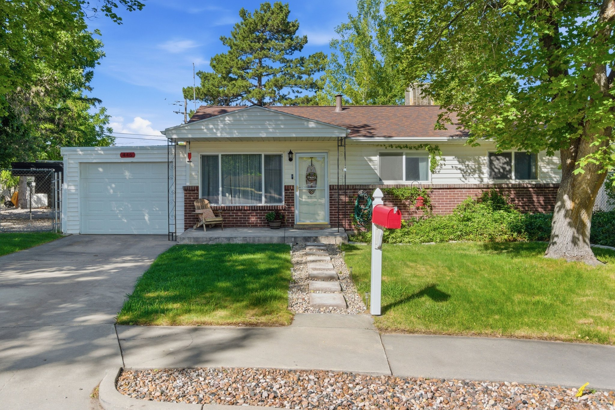 **MULTIPLE OFFERS RECEIVED** Please submit highest and best offer by Sunday June 14th 2:00 PM. Cute 3 Bedroom, 1 Bath brick and vinyl cottage in a quiet cul-de-sac with amazing neighbors. This house has a spacious detached 1 car garage/storage area. You will walk in to durable COREtec flooring in the main living area and original hardwood floors in the bedrooms. The furnace and water heater were replaced in 2024 and both have 10 year warranties. The roof was replaced in 2018 and comes with a 50 year warranty on materials and labor. The kitchen was beautifully remodeled in 2019with a farm sink, pull-out custom cabinetry, granite countertops, and back appliances. Step outside to a fully fenced and landscaped yard with RV parking, mature trees, storage sheds, a large covered patio, raised block garden beds with a separate water source, a firepit area, and a second paves patio with plenty of space for outdoor dining. the swing set and a brand new evaporative cool are included!  Square footage figures are provided as a courtesy estimate only and were obtained from county records .  Buyer is advised to obtain an independent measurement.