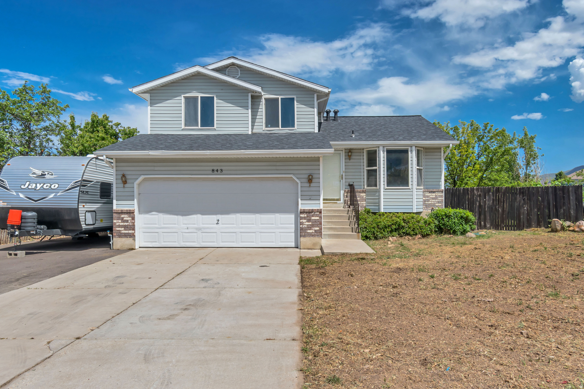 This well-maintained Tooele tri-level home has been lovingly cared for and is nestled in an established neighborhood featuring spacious lots and RV parking. Enjoy peace of mind with a new roof, along with a newer furnace and water heater already in place. The partially unfinished basement provides an excellent opportunity to add additional living space, customize to your needs, and build future equity. Situated on a desirable corner lot, the property offers a large yard with mature trees, plenty of outdoor space, and endless potential to create your ideal backyard retreat this summer. Conveniently located near schools, parks, shopping, and everyday amenities, this home offers both comfort and opportunity.