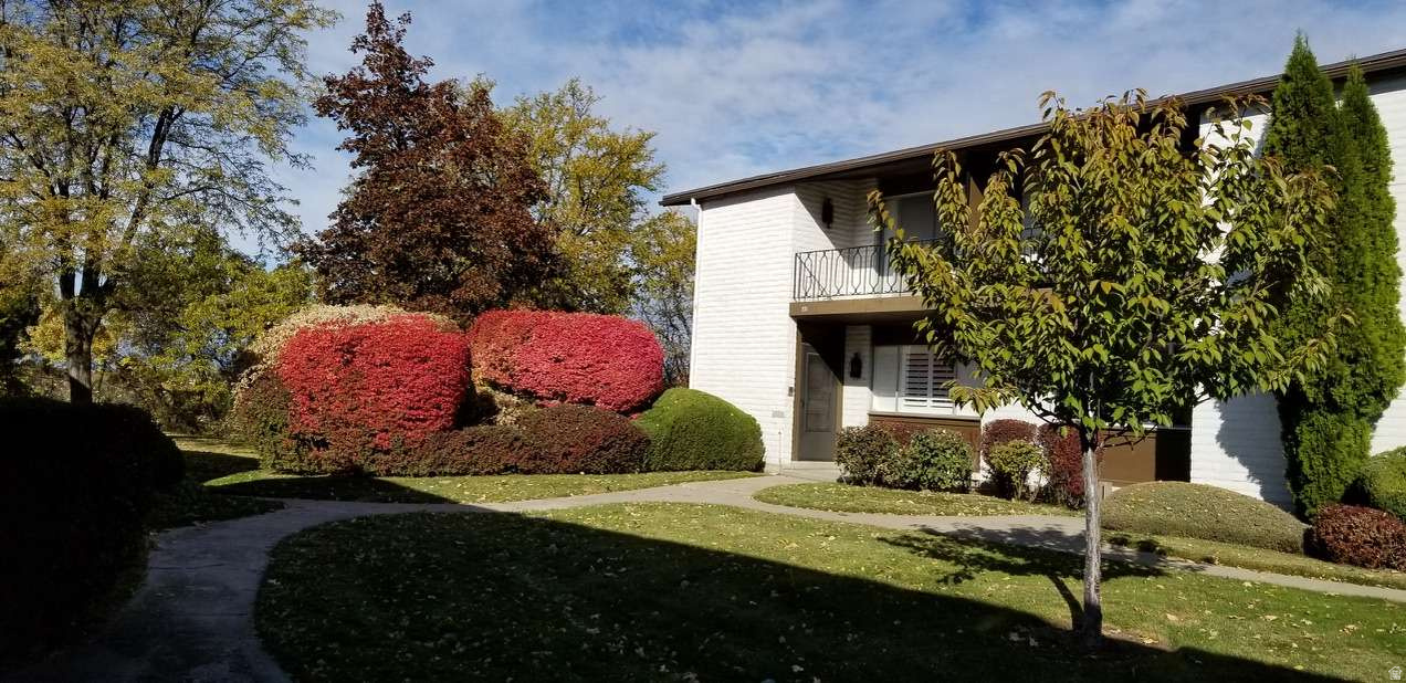 RARE FIND, PRICED WELL BELOW MARKET VALUE: beautifully landscaped setting. LIVING SPACES: Open concept living room, dining and kitchen. Large windows ensure all rooms flooded with natural light. KITCHEN: Updated cabinets, granite countertops, stainless steel appliances. Large kitchen sink window provides a view of the beautiful patio. PATIO: Entering from a 2-car covered carport, visitors enveloped by verdant bushes and blooming flowers. BEDROOMS: Large primary bedroom, ensuite bathroom, walk-in-closet is a private retreat with private balcony and view of Mt. Timpanogos. A large guest bedroom with a sunny south exposure includes a private bathroom. BASEMENT: 100% finished, large den, 1 bedroom, 1 bathroom, laundry room, storage. COMMUNITY: Elegant neighborhoods, schools, grocery store, post office, Riverwooods shopping, dining, fast foods, close to gorgeous Provo Canyon.