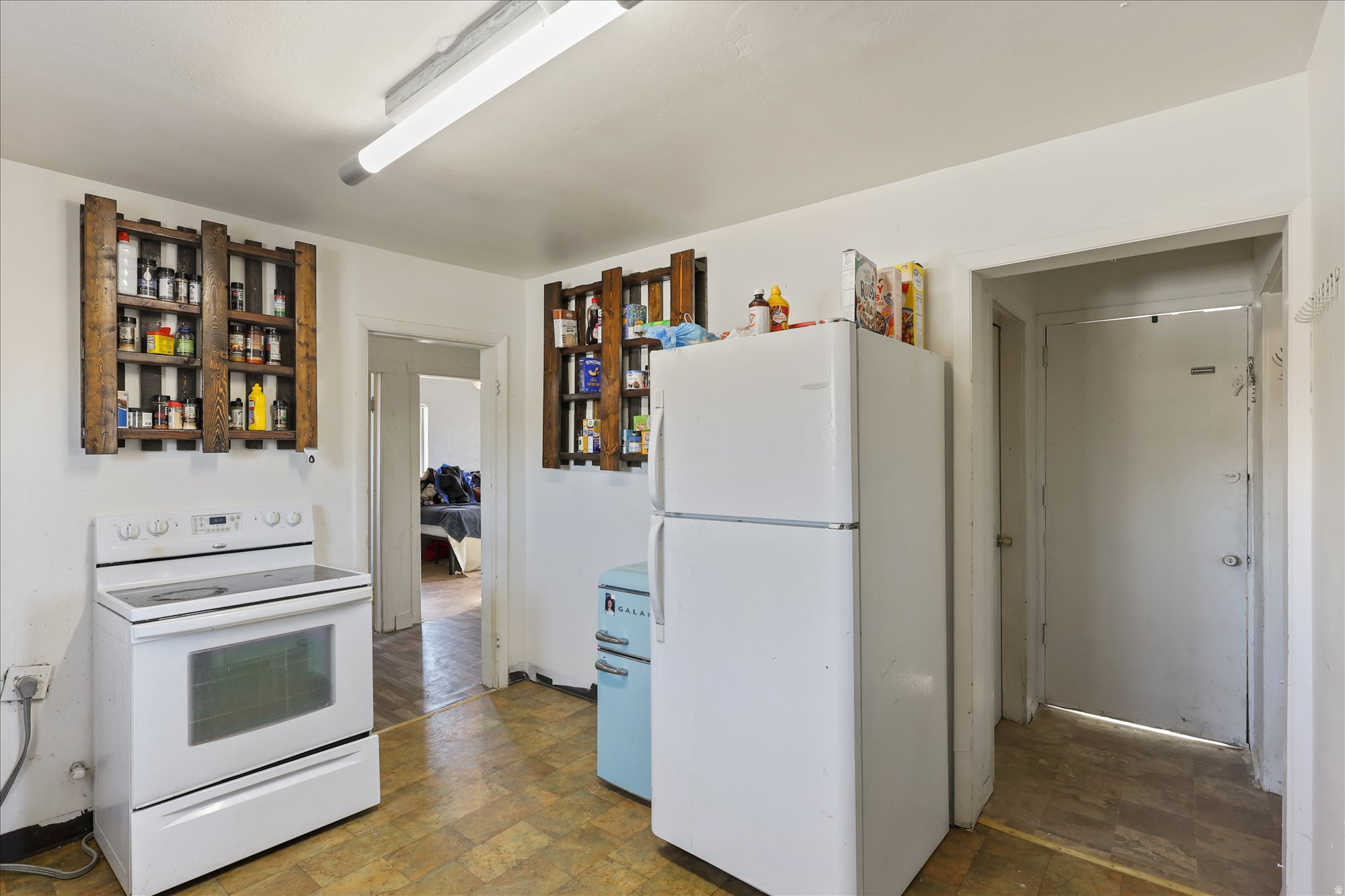PRICE IMPROVEMENT - lowest priced tri-unit property in Utah and Juab Counties AND cashflowing! We will send P&L from 2025 upon request. Conveniently located across from the elementary school on Goshen Main St. Two units rent at $1200/month and the other is $1000/month. The owner also leases out the garage for storage at $300/month! Two tax ID's/parcels included in one sale. Strong rental history since purchased in 2007. Three separate addresses - 14, 16, & 18 E Main St. - all square footage estimates are from county records, buyer/buyer brokers advised to obtain independent estimates.