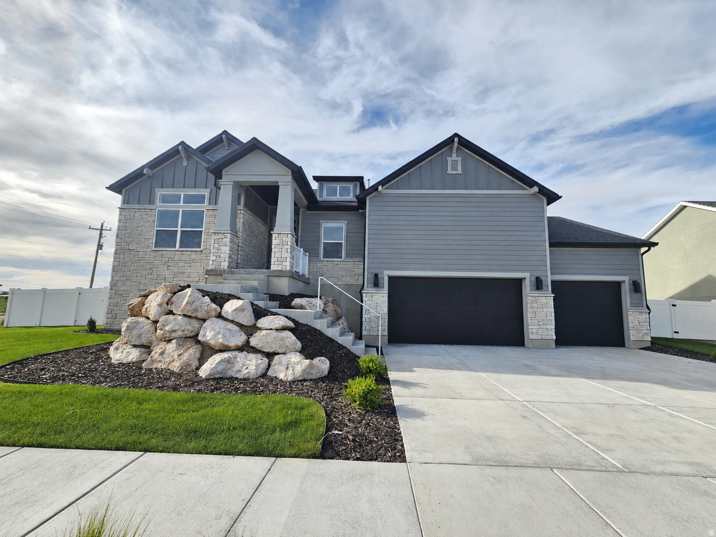 Experience the charm of country living in this stunning rambler model home. Fully landscaped and fenced, it features a spacious three-car garage, inviting covered patio, and a beautiful gourmet kitchen. The large gathering space is perfect for entertaining family and friends, while thoughtful design and quality finishes create comfort, style, and functionality throughout. Ask about our Lender incentives.