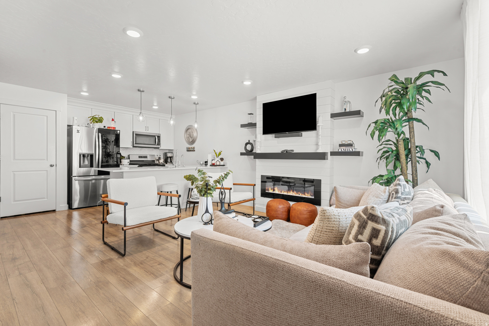 Beautiful END UNIT townhome in Magna featuring an open-concept layout, abundant natural light, laminate flooring, Silestone countertops, stainless steel appliances, and modern finishes throughout. This well-maintained home offers 3 bedrooms, 2 bathrooms, a beautiful fireplace in the living room, and a spacious 2-car garage. Enjoy access to community amenities including a clubhouse, playground, and swimming pool. Conveniently located near schools, shopping centers, restaurants, parks, and with easy access to major freeways and downtown Salt Lake City