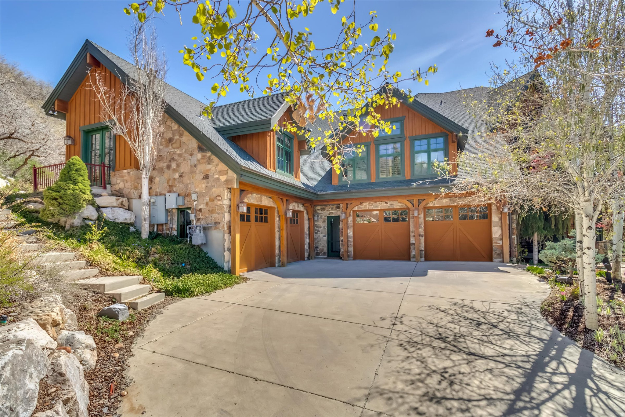 A PRIVATE MOUNTAIN CHATEAUIN EAGLEWOOD COVE,set at the end of a secluded cul-de-sac , this French-inspired mountain chateau offers rare privacy . Built with commercial-quality steel framing, timber beams, and stone cladding. The interior boasts 32-foot ceilings and solid brass hardware throughout. A chef's kitchen features double Sub-Zero refrigerators and a Wolf commercial range, the primary suite offers a spa-like retreat with a Finnish wet-dry sauna and a private patio.  This estate is designed for high-end entertaining and recreation, featuring:* A massive wine cellar and food larder. With an indoor pickleball and basketball court.* A private theater with custom lighting. * A walkout basement apartment that serves as a private ADU with a full kitchen.The 1.8-acre grounds include a four-car garage with epoxy floors.Ideally located, this home is just minutes from the city .