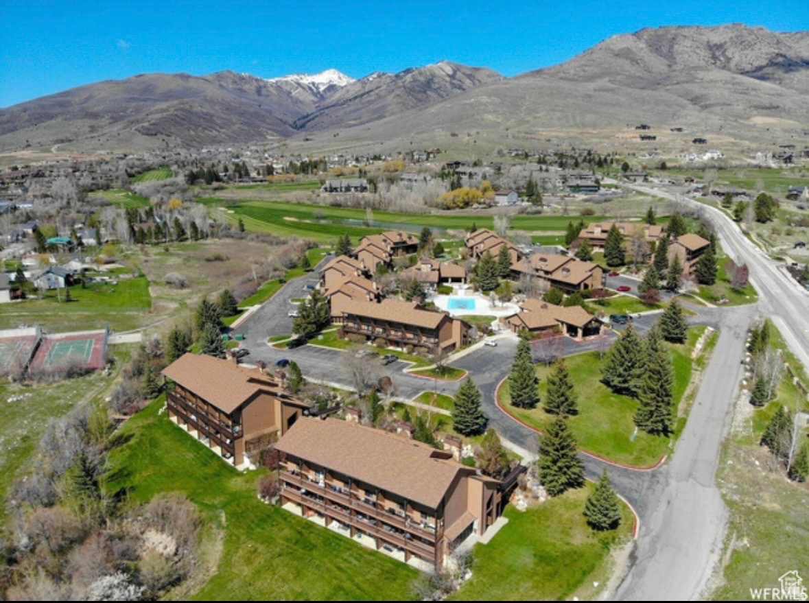 PRICE DROP!! Great Investment ! This condo offers High vaulted ceilings for that large open feel. Stunning views of Powder Mountain Canyon and overlooks the 12th hole of the Wolf Creek Golf Course. Community amenities include a year-round hot tub, summer pool, putting green, gym, laundry area. HOA monthly fee also includes paid: water, sewage, trash and Direct TV. Perfect as a full time home , vacation getaway or a short term rental. Square footage figures are provided as a courtesy estimate only. Buyer is advised to obtain an independent measurement.