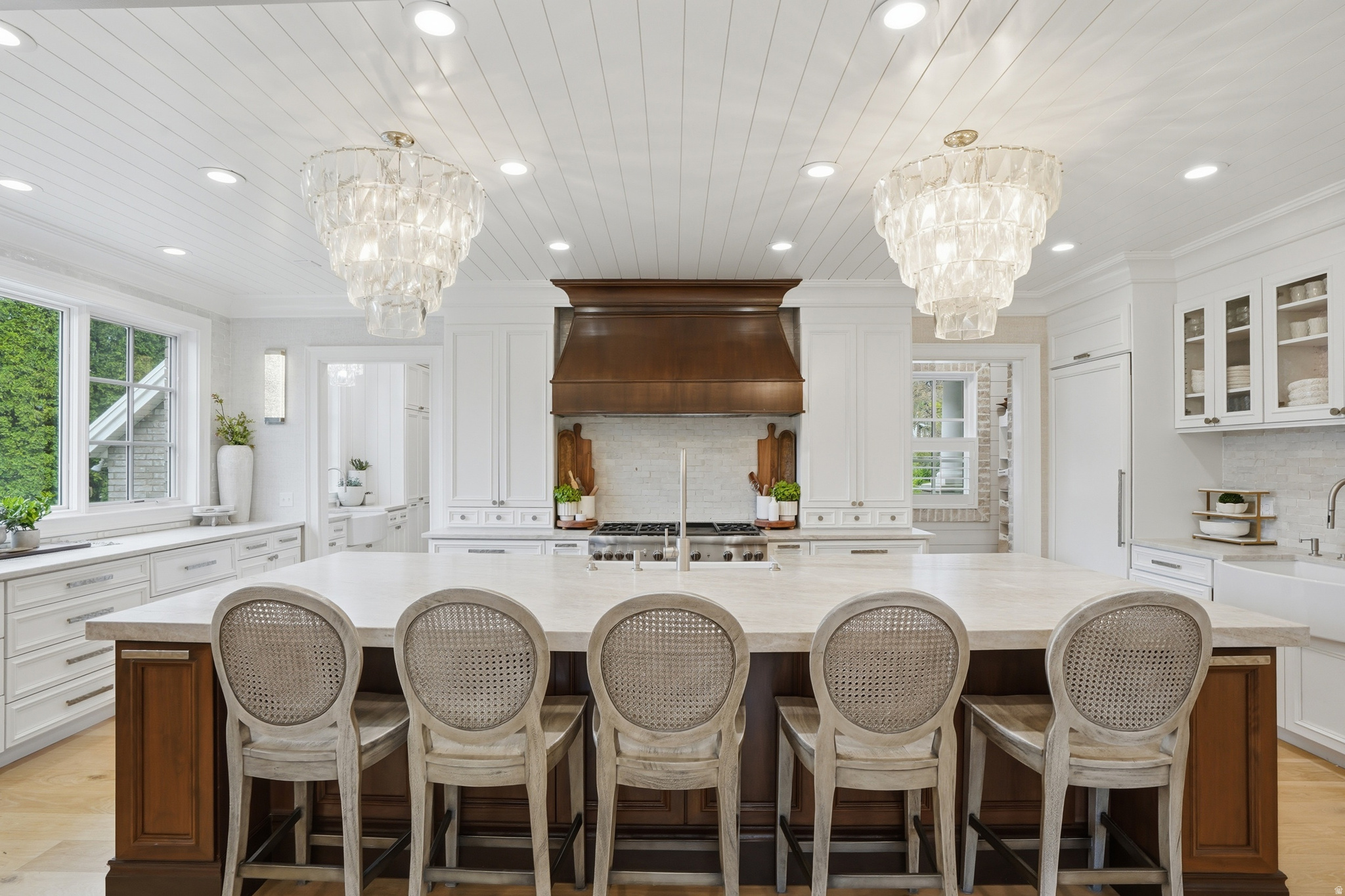 Completely remodeled in 2022, this exceptional Alpine estate sits on a quiet cul-de-sac and blends luxury with thoughtful design throughout. Highlights include beautiful new wood gridded and non-gridded Pella windows, European white oak floors, iron doors, and a Gourmet Chef's Kitchen with a 12x5 walnut island, quartzite surfaces, 48-inch 6-burner Thermador range with griddle stove, 36-inch SubZero fridge, 36-inch SubZero freezer, 2 Bosch dishwashers, 2 warming drawers, and 2 butler's pantries. The lower level features a mother-in-law apartment with private entrance, full kitchen, laundry, bath, and 2 bedrooms. Resort-style backyard offers 2 fiberglass saltwater pools, the second pool  seats 20+, heats above 100 degrees for a hot tub, or chills to approximately 42 degrees for cold plunges. Plus a regulation-size pickleball court/basketball court and mature landscaping. New roof in 2020. Minutes from American Fork Canyon, Alpine Country Club, Cedar Hills Golf Club, multiple parks, and Thanksgiving Point for shopping, dining, and entertainment.