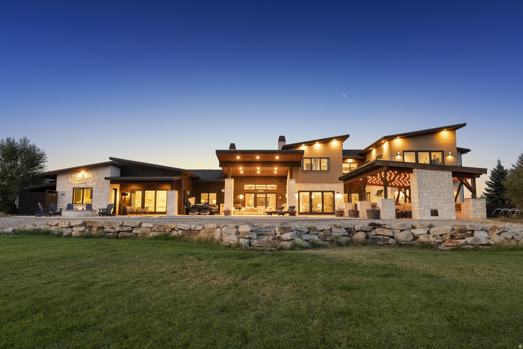 Set on 10 private acres in the coveted Silvercreek neighborhood, this expansive Park City estate offers commanding, unobstructed mountain views and an impressive 12,100 square feet of refined living space. Built in 2015, the home is thoughtfully designed for both elevated everyday living and large-scale entertaining, with a layout and setting that offer space, privacy, and connection-just minutes from everything Park City has to offer. The home features 7 large bedrooms and 9 bathrooms, providing ample room to host, relax, and recharge. Nearly 2 acres are fully fenced and landscaped, with a pool, hot tub, gazebo, and firepit-all positioned to capture the stunning mountain views. Inside, limestone and hardwood floors, 7 fireplaces, and light interior stone walls add warmth and natural elegance throughout the main living areas. Additional highlights include a 1,500-square-foot gym with a partial basketball court, a game room, central heating and air, and a dedicated wine room. Garage space accommodates up to 8 vehicles, including two oversized, double-deep bays. The property is being offered fully furnished, making it move-in ready from day one. Ideally located just 10 minutes from Kimball Junction and Whole Foods, 15 minutes from the East Village at Deer Valley, and with quick access to both Heber City and Salt Lake City International Airport, this is a rare opportunity to own a home that balances beauty, comfort, and convenience-set against one of Park City's most dramatic and expansive view corridors.