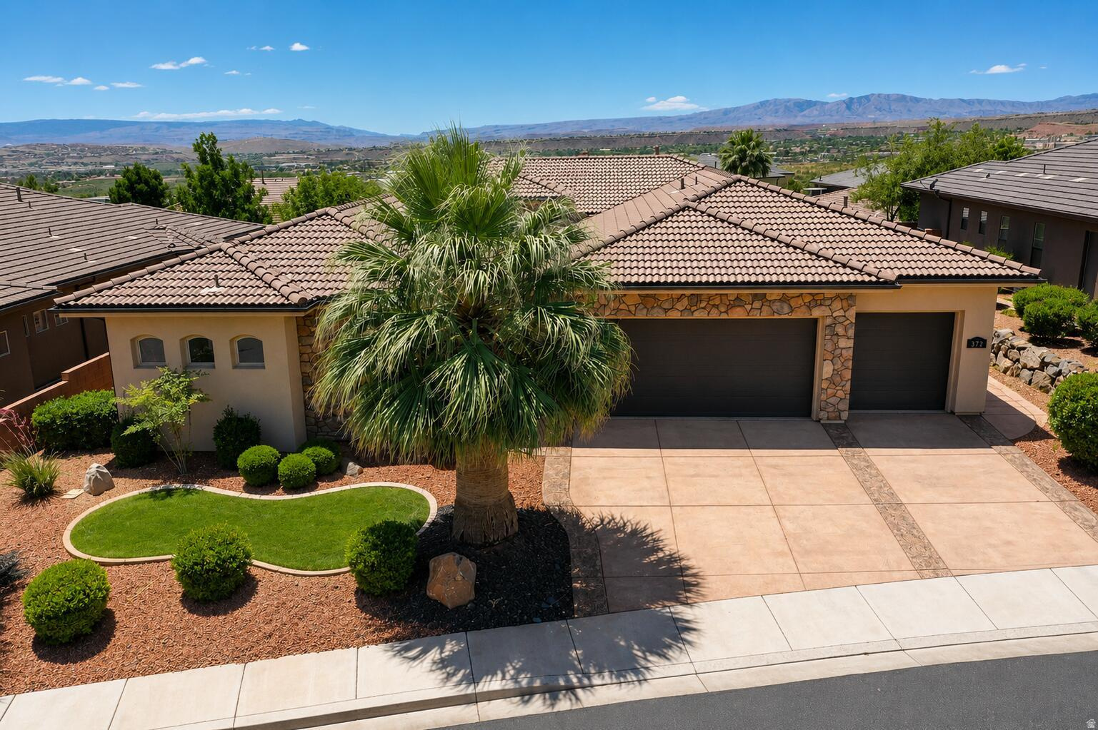 Welcome to luxury living in one of Southern Utah's most desirable gated communities. Perched on an elevated hillside, this immaculate 4-bedroom, 3.5-bathroom home offers breathtaking views, exceptional craftsmanship, plenty of storage with 4 extra closets strategically placed through the home, and a private attached casita complete with its own bedroom, bathroom, and kitchenette--perfect for guests, extended family, or additional rental flexibility. Inside you will discover a beautifully maintained interior featuring elegant coffered ceilings, granite countertops, and top-of-the-line appliances. The open-concept design creates a seamless flow for both everyday living and entertaining. Laundry room is oversized with a sink and extra storage closet. Located in a clean, quiet, and beautifully landscaped gated community, residents enjoy peace, privacy, and a premier Southern Utah lifestyle. The fully enclosed yard provides added privacy and security, making it ideal for pets, children, and outdoor entertaining. This super-clean, move-in-ready home combines luxury finishes, versatile living space, and an unbeatable location with spectacular views. Car enthusiasts and outdoor adventurers will appreciate the oversized tandem-style 4-car garage. Designed with an extra-deep single-car bay, the garage comfortably accommodates four vehicles while still providing ample space for storage, a workshop, bikes, or outdoor gear. Don't miss this rare opportunity to own a pristine home in one of Southern Utah's most sought-after communities.