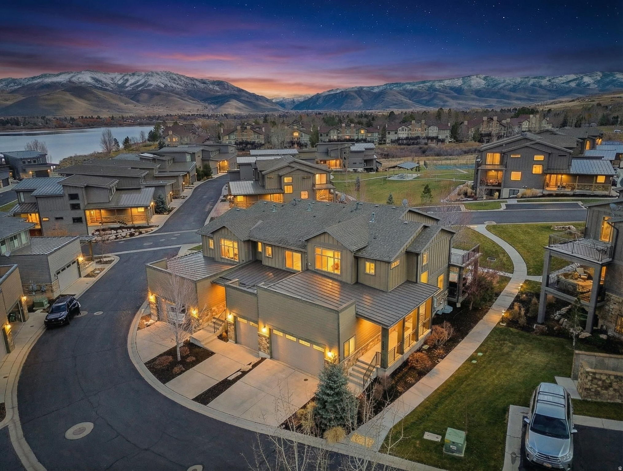 Located next to Pineview Reservoir with beautiful views of Snowbasin Resort, this townhome offers a rare combination of luxury mountain living, everyday comfort, and rental potential. With 4 bedrooms and 4.5 bathrooms, the thoughtfully designed layout provides generous space for full-time living while remaining easy to lock and leave for second-home owners or those interested in optional nightly rental income.  The open-concept interior features a well-appointed kitchen, spacious gathering areas, and multiple private bedroom suites, making the home ideal for hosting guests, multi-generational living, or working remotely. A private deck and hot tub extend the living space outdoors and create the perfect setting to relax after a day on the lake, trails, or ski slopes.  Community amenities include a seasonal pool, hot tub, pickleball courts, and lake access, enhancing both the enjoyment of the property and its appeal as a potential rental.  Snowbasin Resort, Powder Mountain, Nordic Valley, and the year-round recreation of the Wasatch Back are all nearby. Whether you are looking for a primary residence, second home, or a property that offers flexibility for personal use and income potential, this townhome delivers comfort, versatility, and an exceptional Huntsville location.  It's been said that this Valley is the next Park City!