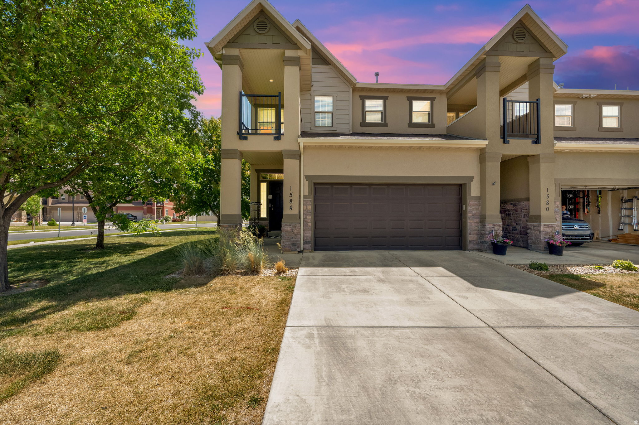 OPEN HOUSE TODAY SAT MAY 30th 11-2pm. Beautiful Row-end townhome with a finished basement and a fully fenced - private backyard in Saratoga Springs. This inviting layout is an open-concept with a spacious living room, and a kitchen complete with rich dark cabinetry, granite countertops, and a comfortable breakfast bar. Upstairs, the generous sized primary suite offers vaulted ceilings, natural light, with a private balcony, and an ensuite bathroom with a separate tub and shower, enclosed toilet room, and generous walk-in closet. The finished basement adds excellent livable space with a large family room, a 3/4 bathroom, an additional walk in storage/pantry area-ideal for guests or multi-use needs. Home also offers a reverse osmosis filter/softener system, and a radon mitigation unit.  Enjoy low-maintenance living with a private backyard, plus unbeatable access to Redwood Road, I-15, local parks, and everyday conveniences including Costco, Walmart, restaurants, and entertainment. A great opportunity to own in one of the fastest-growing areas in Utah. Measurements provided as a courtesy only, buyer to verify all info.