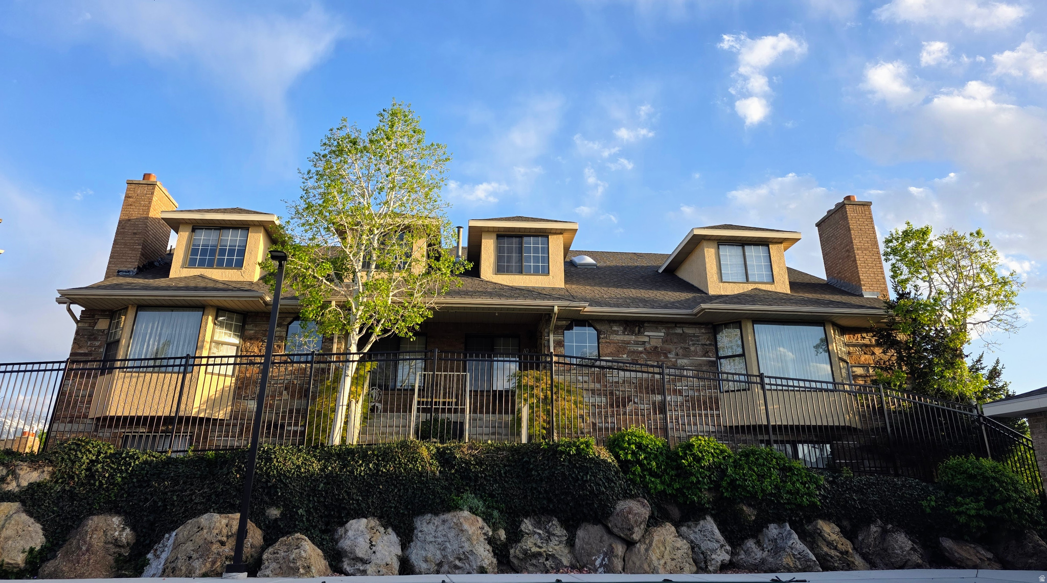 Welcome to a spacious and versatile townhome in the highly desirable Millcreek community, featuring a rare 3 car garage and flexible living with 4 bedrooms and 2 kitchens!  Enjoy a generous floor plan with a large bonus room, perfect for entertaining or creating an ideal gathering space. Take in beautiful mountain views along with a peaceful view of the community pool, adding to the overall appeal.  Ideally located just 15 minutes from downtown Salt Lake City with easy freeway access and only 20 minutes to the stunning nearby canyons.  This is an exceptionally spacious home with great potential. Buyer and buyer's agent to verify all information.