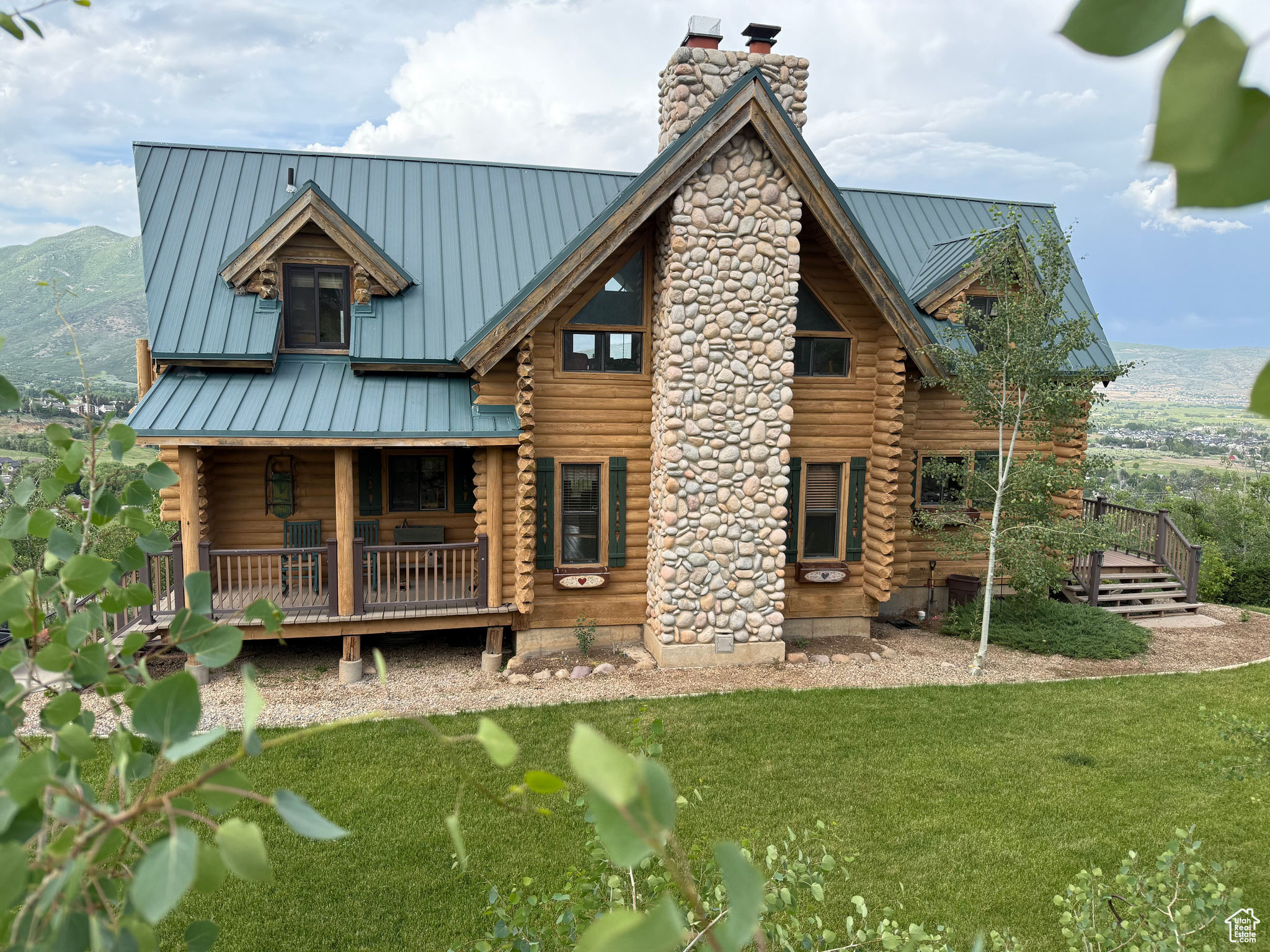 Your secluded mountain sanctuary awaits! Imagine owning a thousand acres-this legacy cabin can provide that feeling. This 1.57-acre property (three parcels) borders Wasatch Mountain State Park, granting you direct access to miles of trails where you can walk, mountain bike, cross-country ski, sled, or even snowmobile, enjoying nature in every season while rarely encountering another soul. The cozy embrace of the full-log cabin, the best views of Midway available anywhere, and the boundless outdoor opportunities make this property truly special.   Originally designed and used as a full-time residence, the cabin offers all the comforts of home. It includes generous gathering spaces, multiple decks and balconies, a lower-level walkout and, with the bunkroom over the detached garage, can readily sleep more than 20. Unlike many mountain properties, this cabin has a lawn and mature landscaping, adding to its comfort, charm, and privacy.   The main floor of the detached 2-car garage has been carpeted and converted to a game room (easily reversible), while the upper floor is a bunk room which, with significant alterations, could become an accessory apartment.   This is more than a home; it's an unparalleled opportunity to own a spectacular piece of Utah's  landscape. If you're lucky enough to get it, you'll create a lifetime of memories and will never let it go!   Many of the furnishings are available for purchase. Water is provided by Swiss Alpine Water Company. 2025 Swiss Alpine Water Company annual dues = $2570 for our three lots ($1300 per cabin lot, $635 per vacant lot). Rates for 2026 have not yet been determined.  Includes Tax ID 2: 00-0002-3981; Tax ID 3: 00-0002-3759